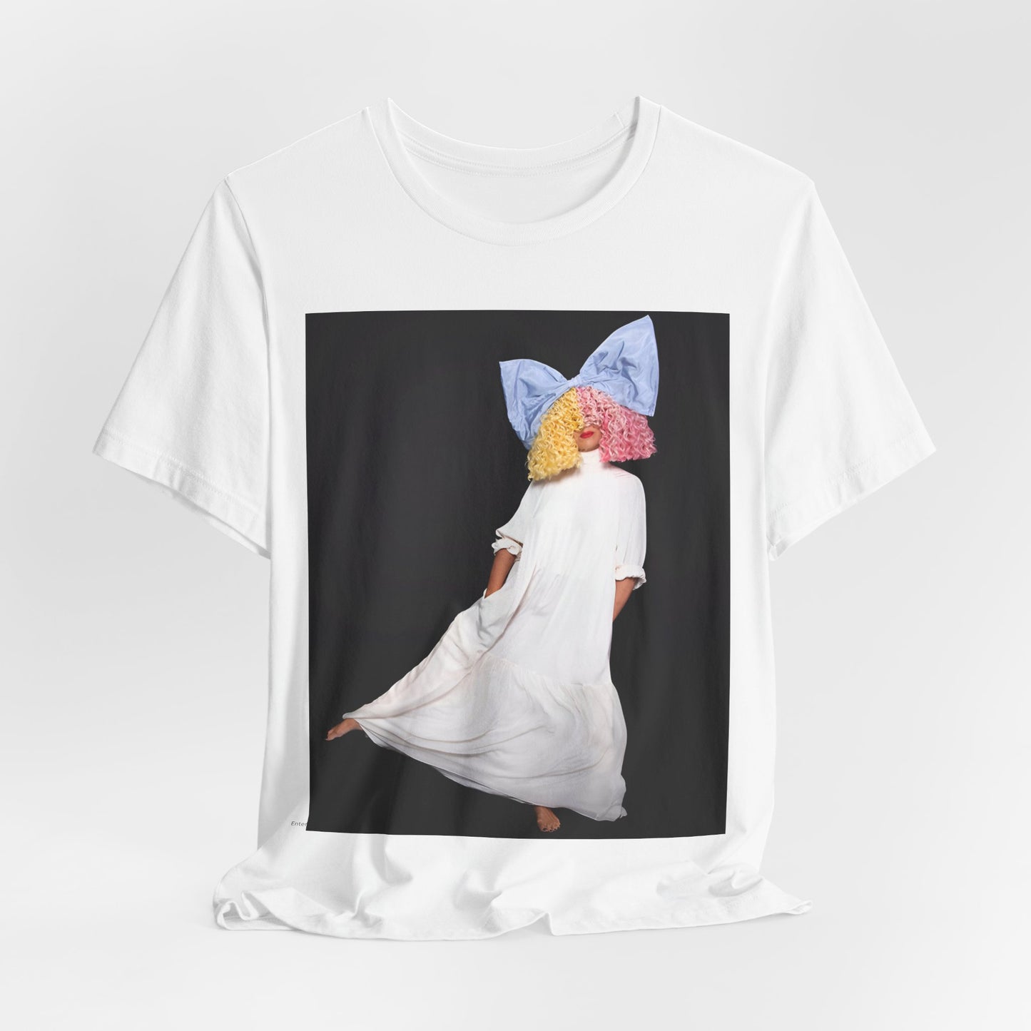 A black graphic t-shirt featuring a vintage pop icon graphic of Sia.