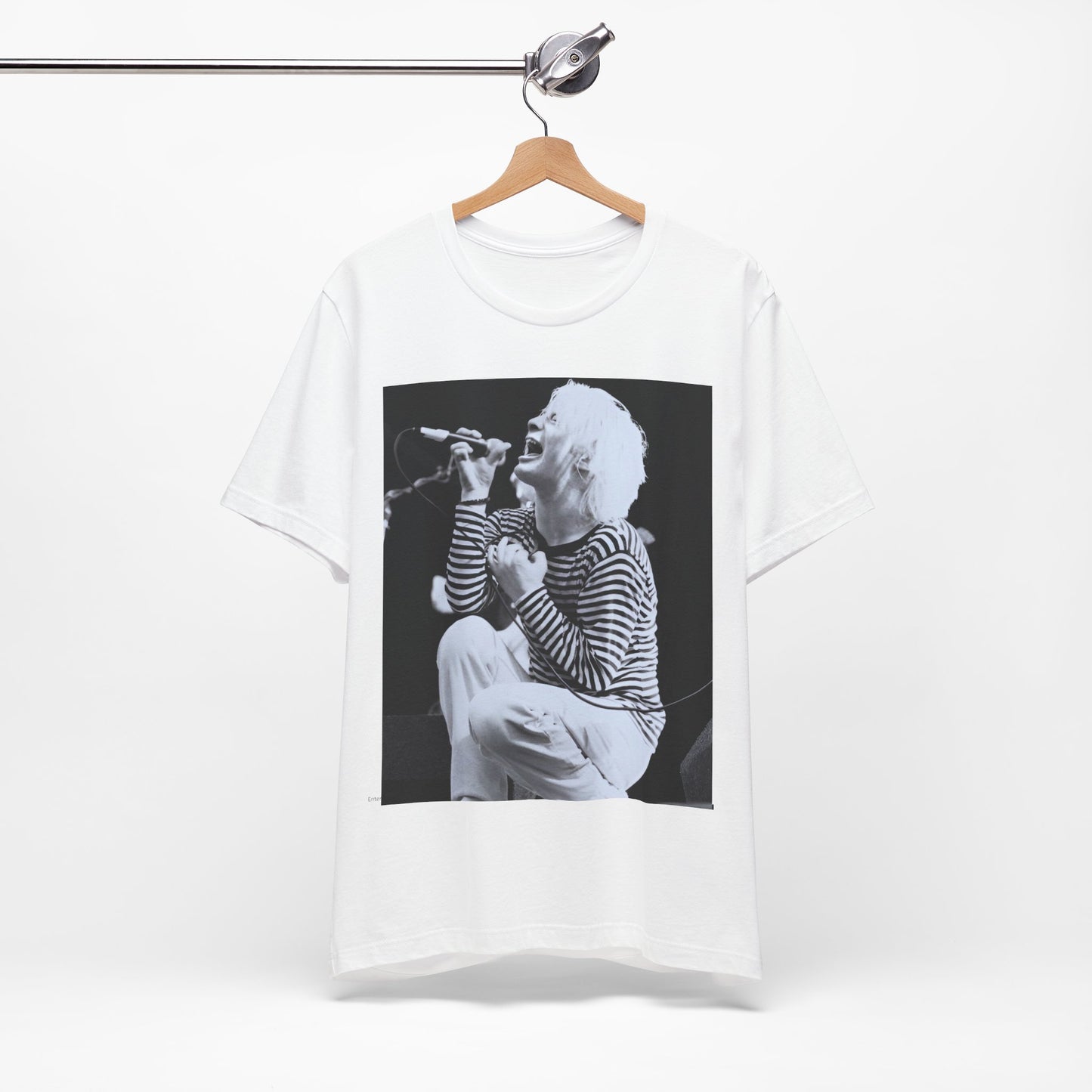 A black graphic t-shirt featuring a black and white graphic or photo of Radiohead performing live.