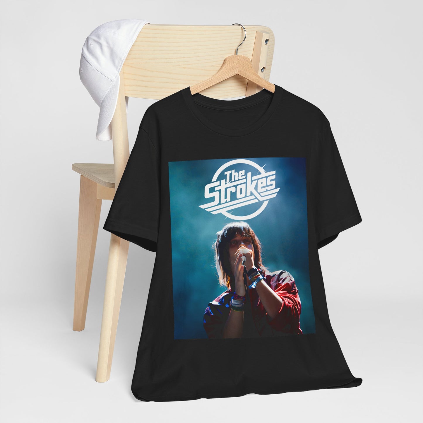 A black graphic t-shirt featuring a portrait or graphic of Julian Casablancas from The Strokes.