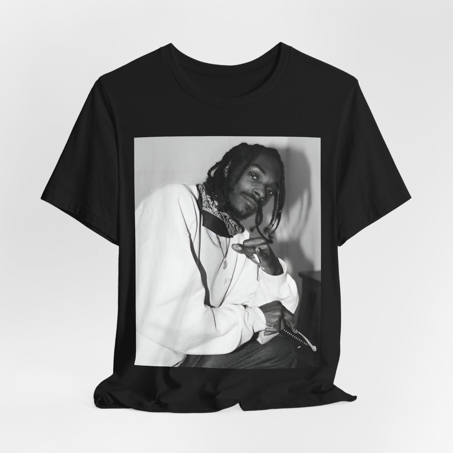 A black graphic t-shirt featuring a black and white hip hop graphic or photo of Snoop Dogg.