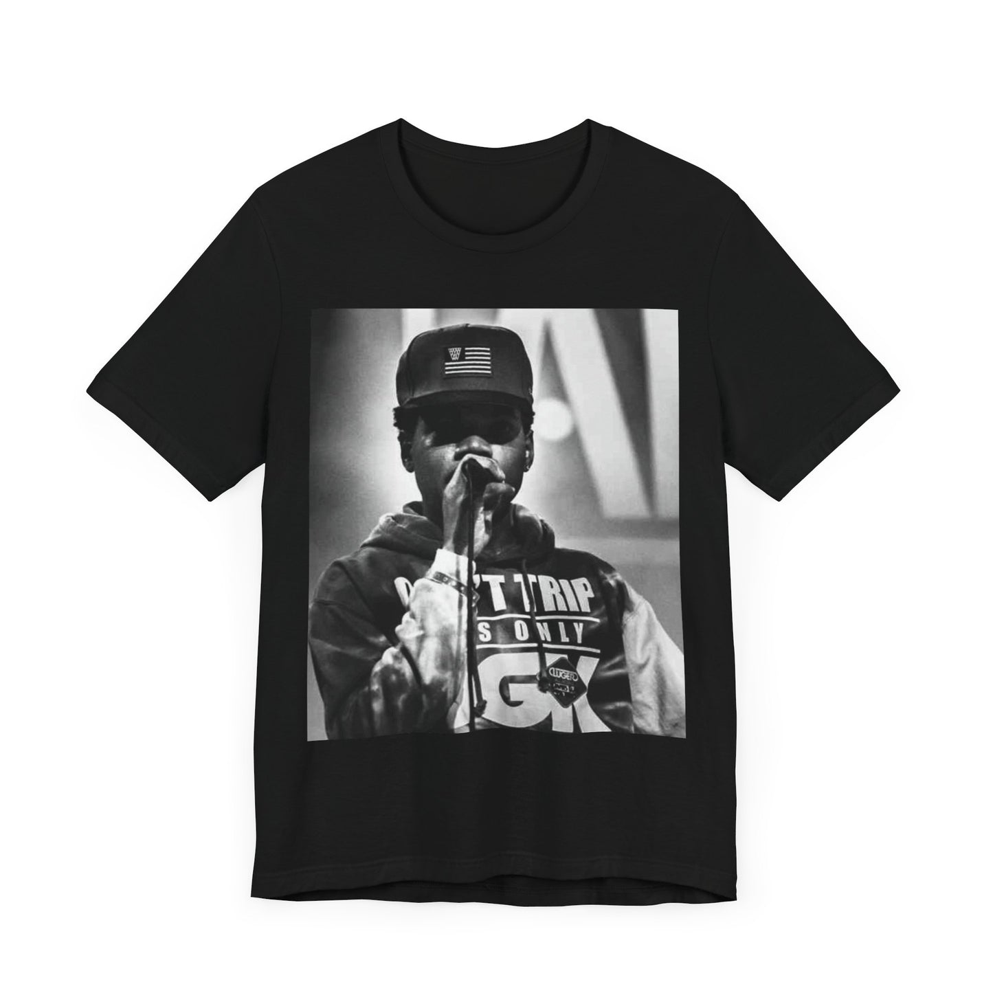 A black graphic t-shirt featuring a vintage-style graphic or photo of Chance the Rapper performing live.