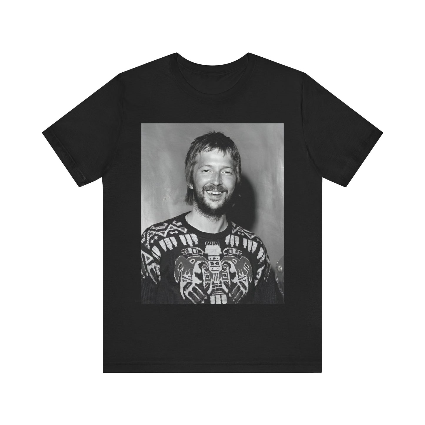 A black graphic t-shirt featuring a 70s photo portrait of Eric Clapton.