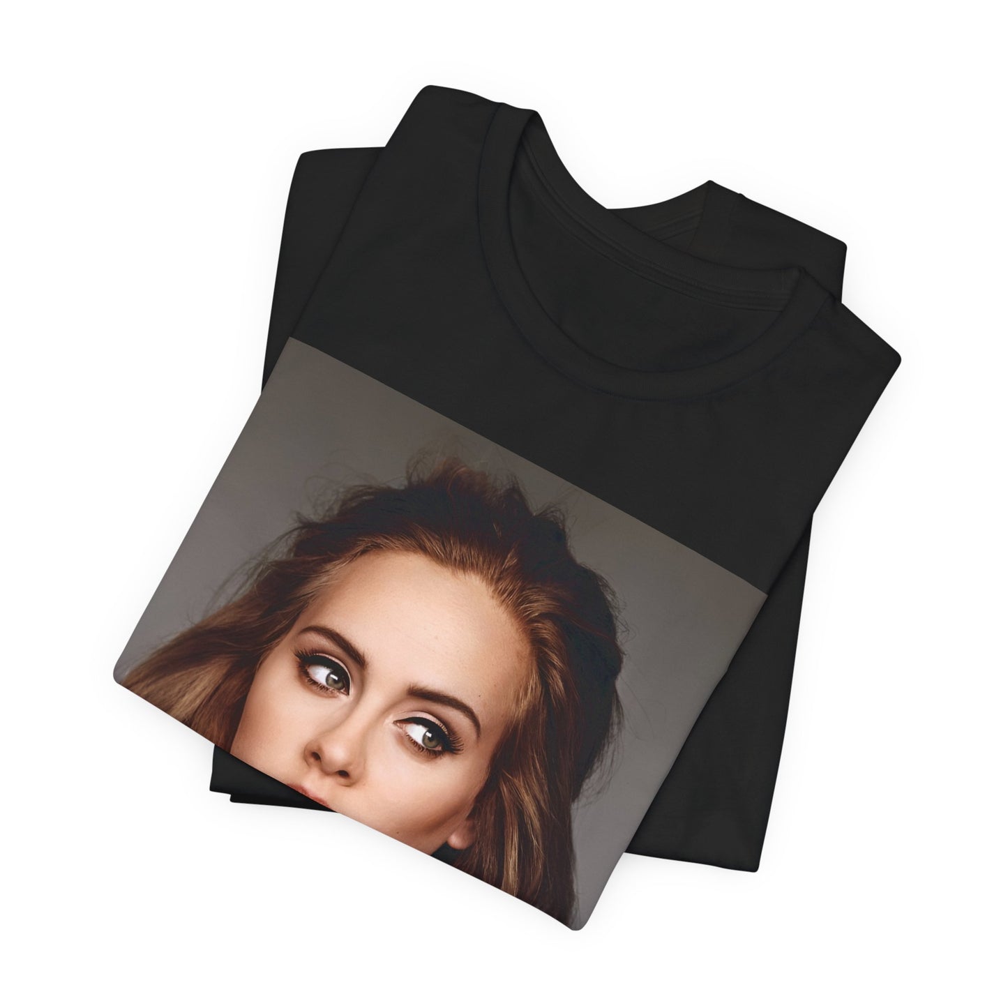 A black graphic t-shirt featuring a studio portrait of Adele from her '25' album era, showing a thoughtful or serene expression.