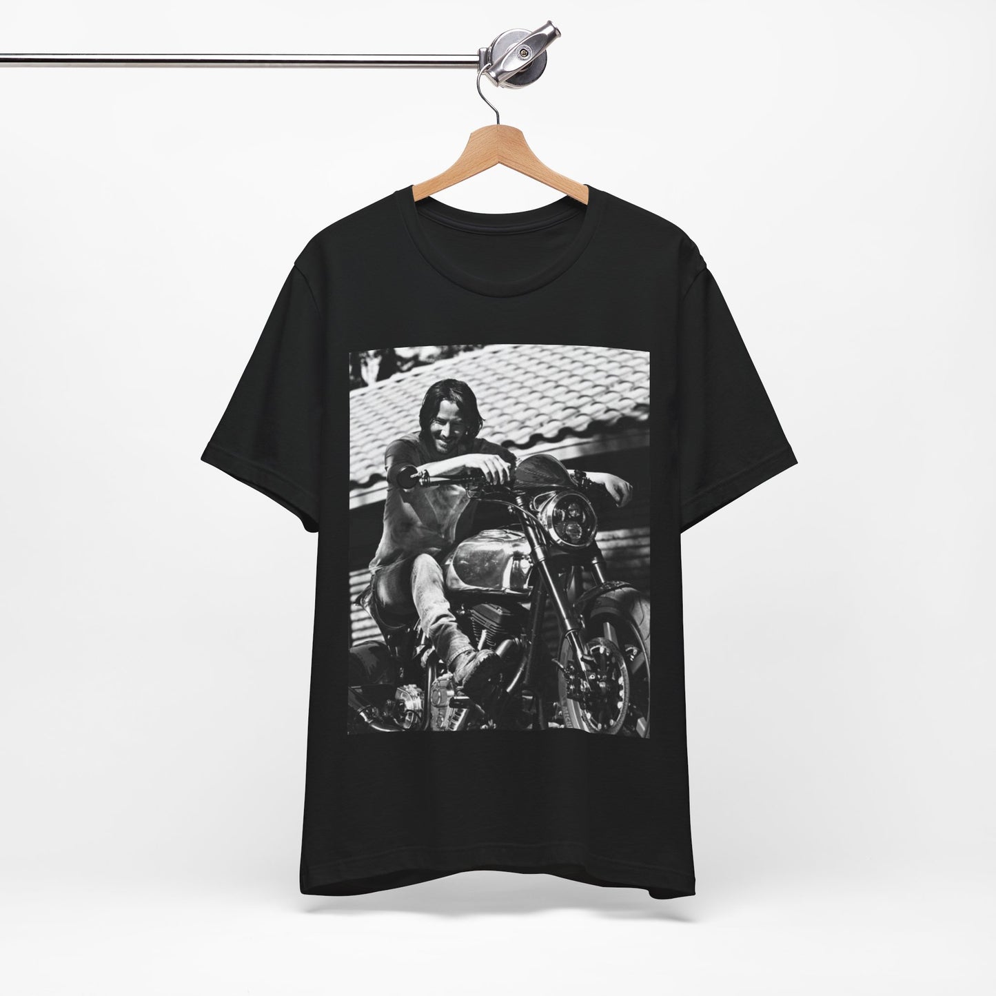 A black graphic t-shirt featuring a black and white photo of Keanu Reeves on a motorcycle.
