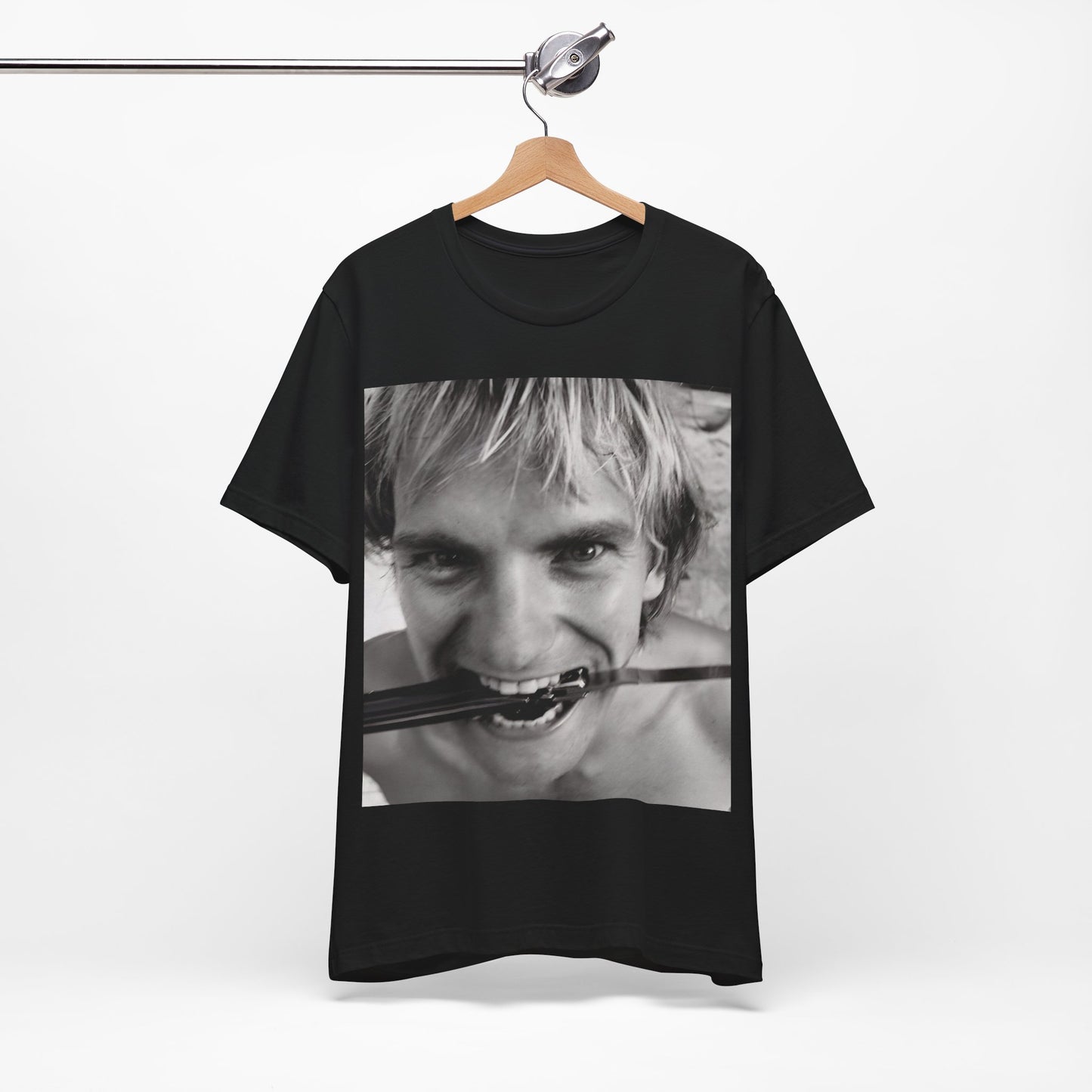 A black graphic t-shirt featuring a wild photo graphic of Sting.