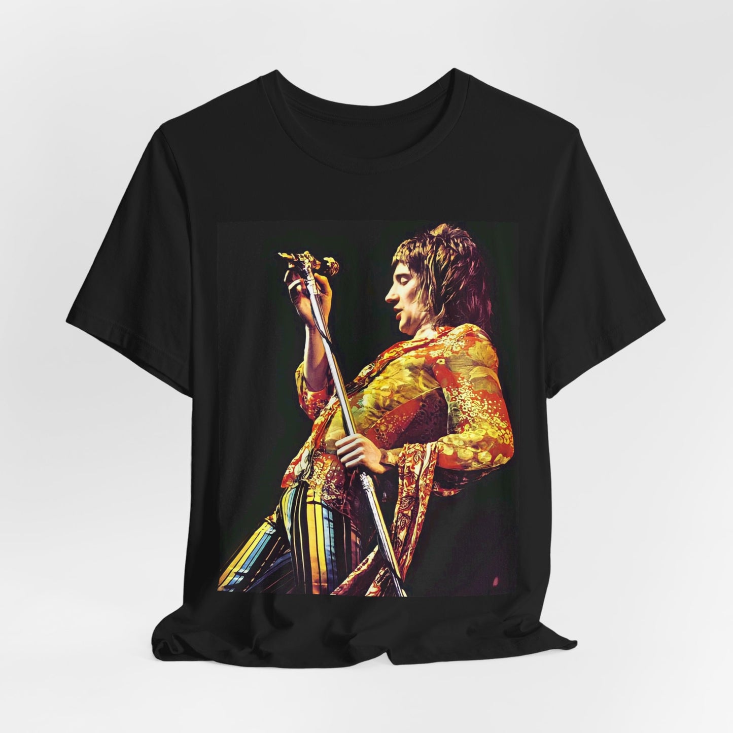 A black graphic t-shirt featuring a retro 70s graphic or photo of Rod Stewart performing live on stage.