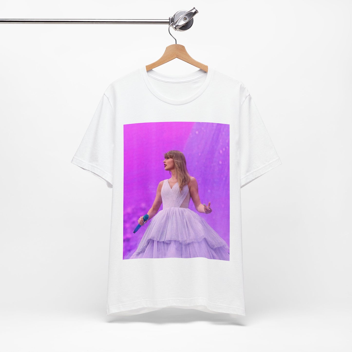A black graphic t-shirt featuring a graphic or photo of Taylor Swift performing live on stage.