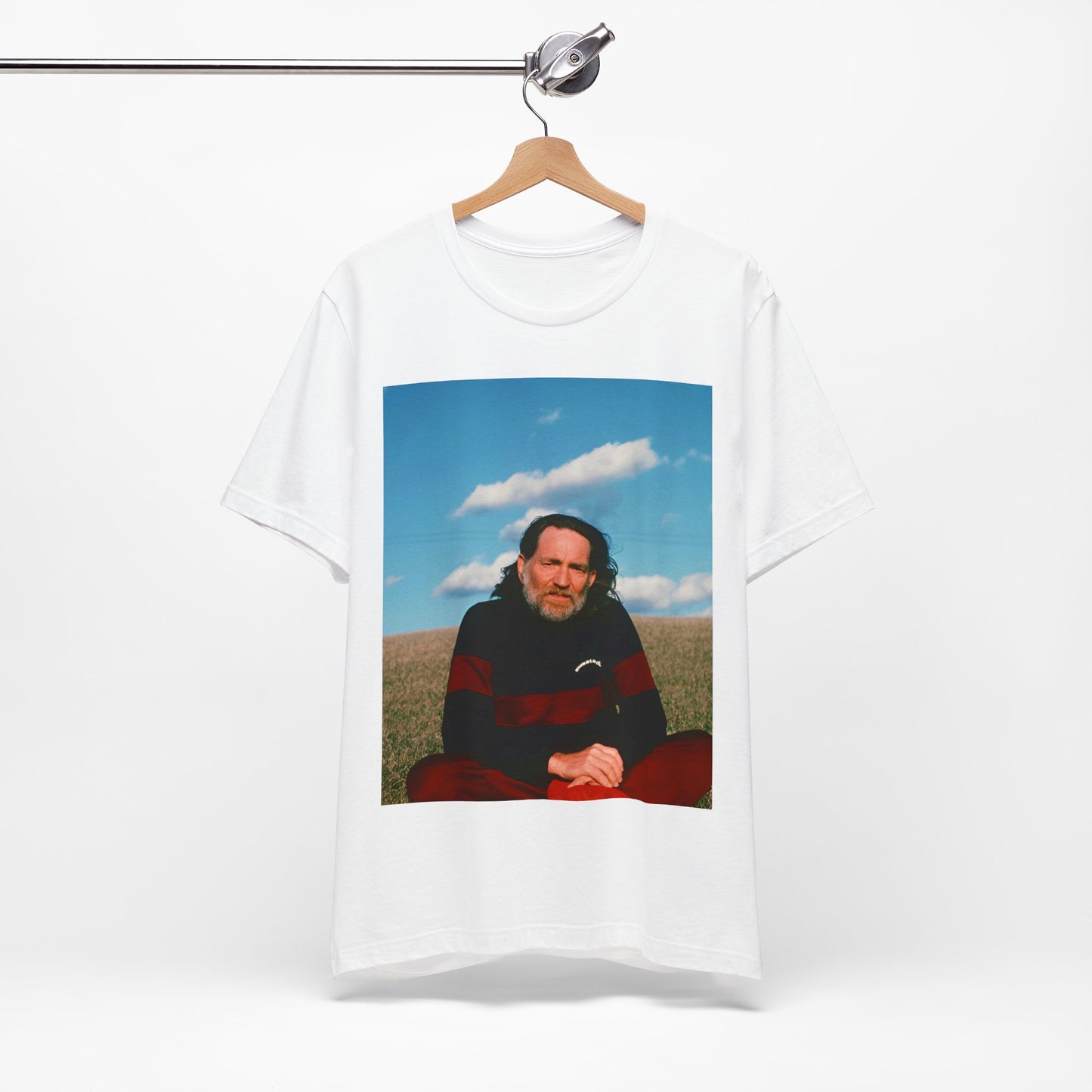 A black graphic t-shirt featuring a classic outlaw country graphic of Willie Nelson.
