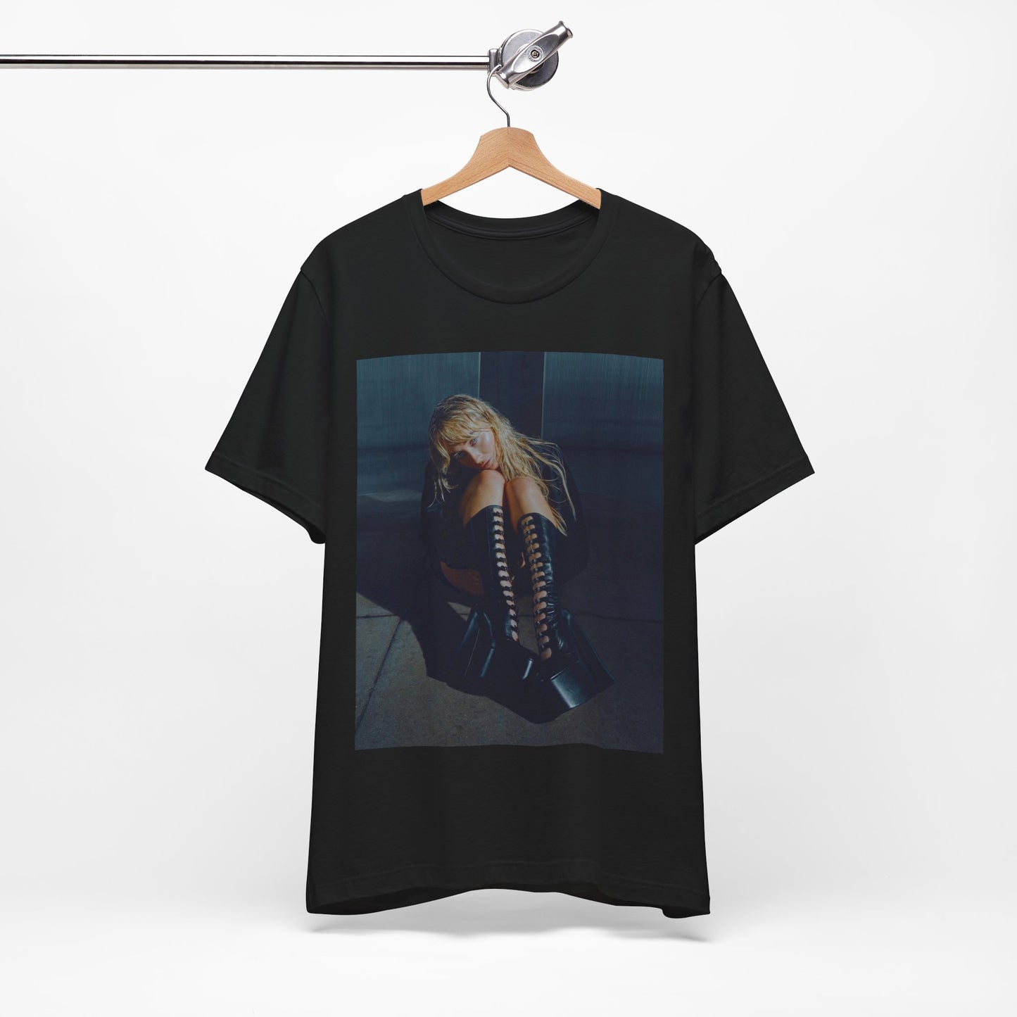 A black graphic t-shirt featuring a bold graphic of Sabrina Carpenter as a pop superstar.