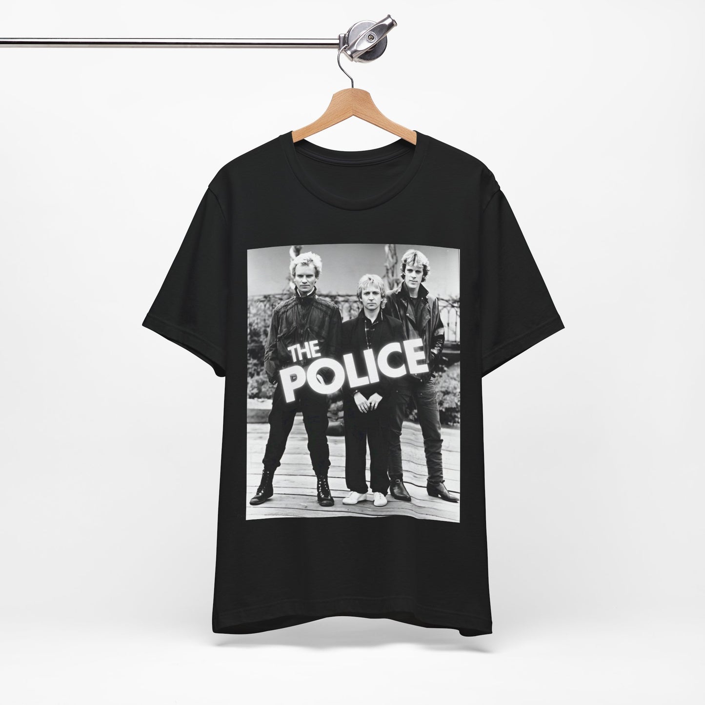 A black graphic t-shirt featuring an 80s pop rock aesthetic black and white graphic of The Police.