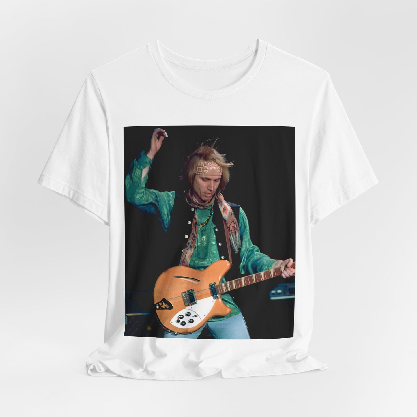 A black graphic t-shirt featuring an 80s American rock aesthetic graphic of Tom Petty.