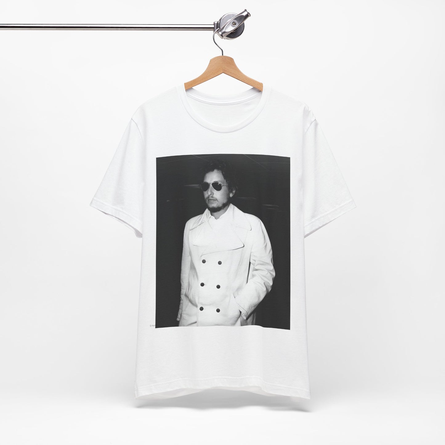 A black graphic t-shirt featuring a vintage black and white photo of Bob Dylan in a contemplative or iconic pose.