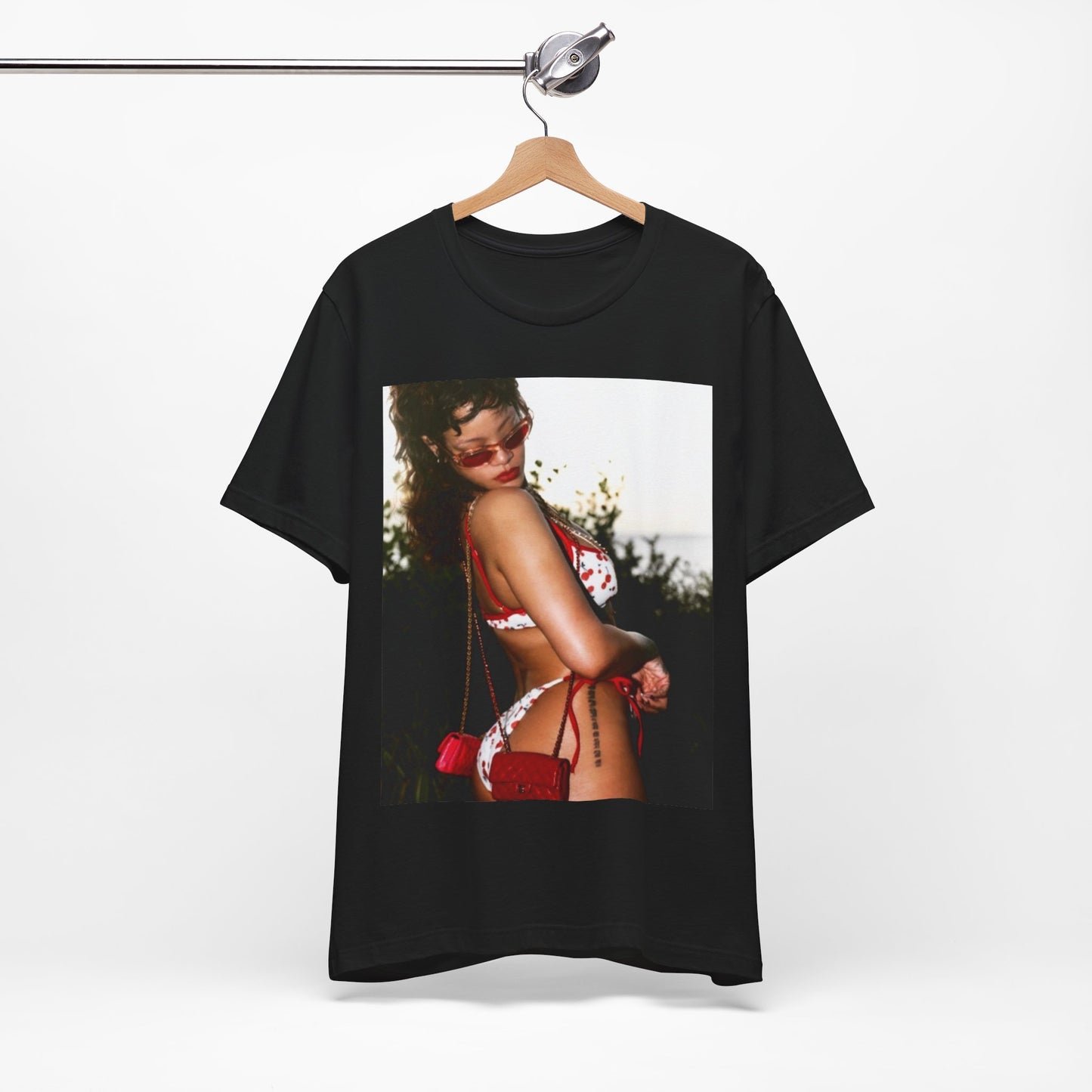A black graphic t-shirt featuring a photo graphic of Rihanna in a bikini.