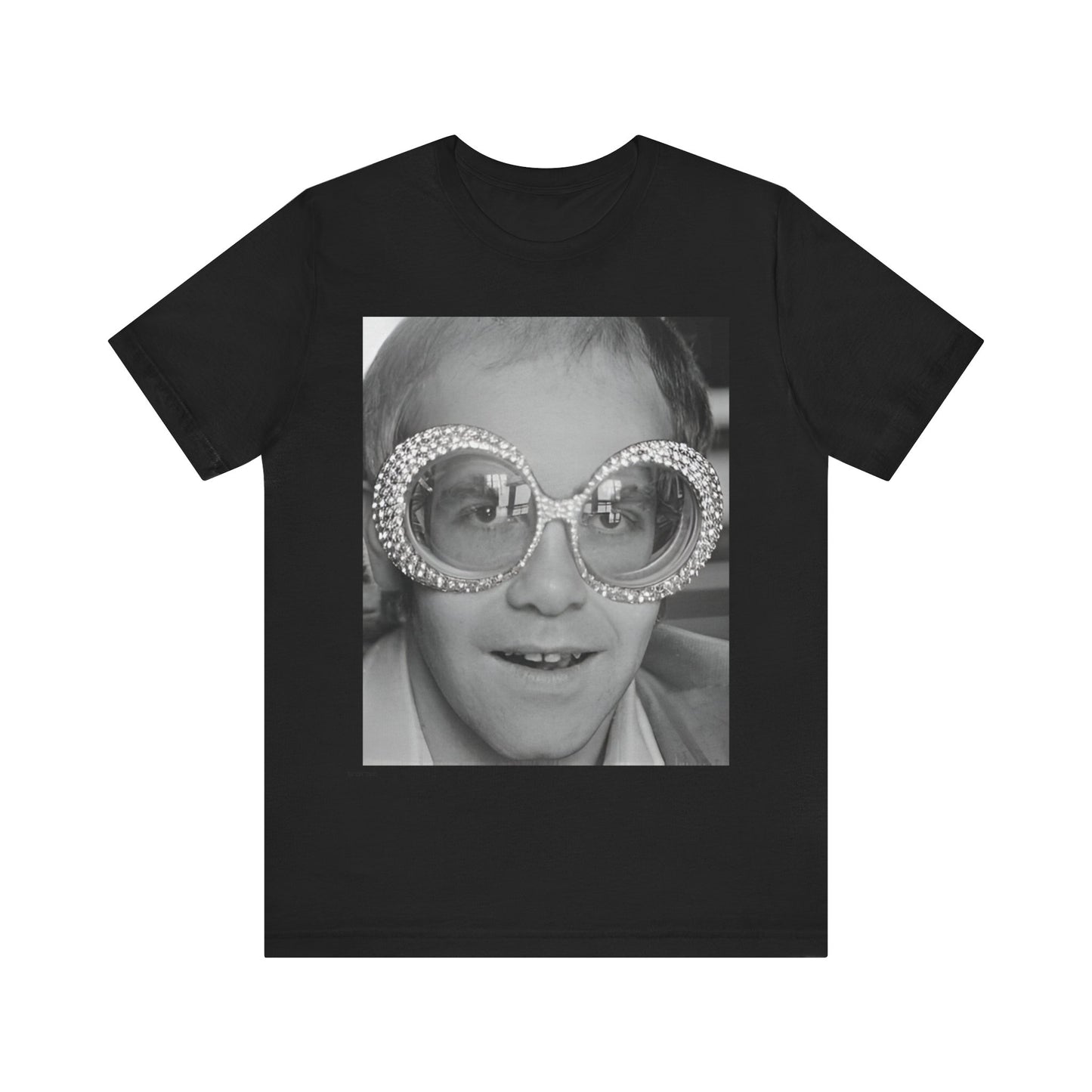 A black graphic t-shirt featuring a graphic of Elton John emphasizing his iconic glasses and fashion.