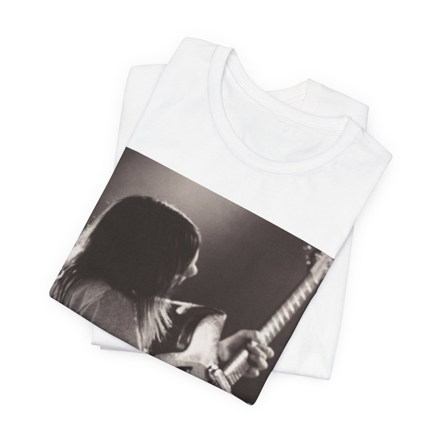 A black graphic t-shirt featuring a black and white graphic or photo of Tame Impala performing live on stage.