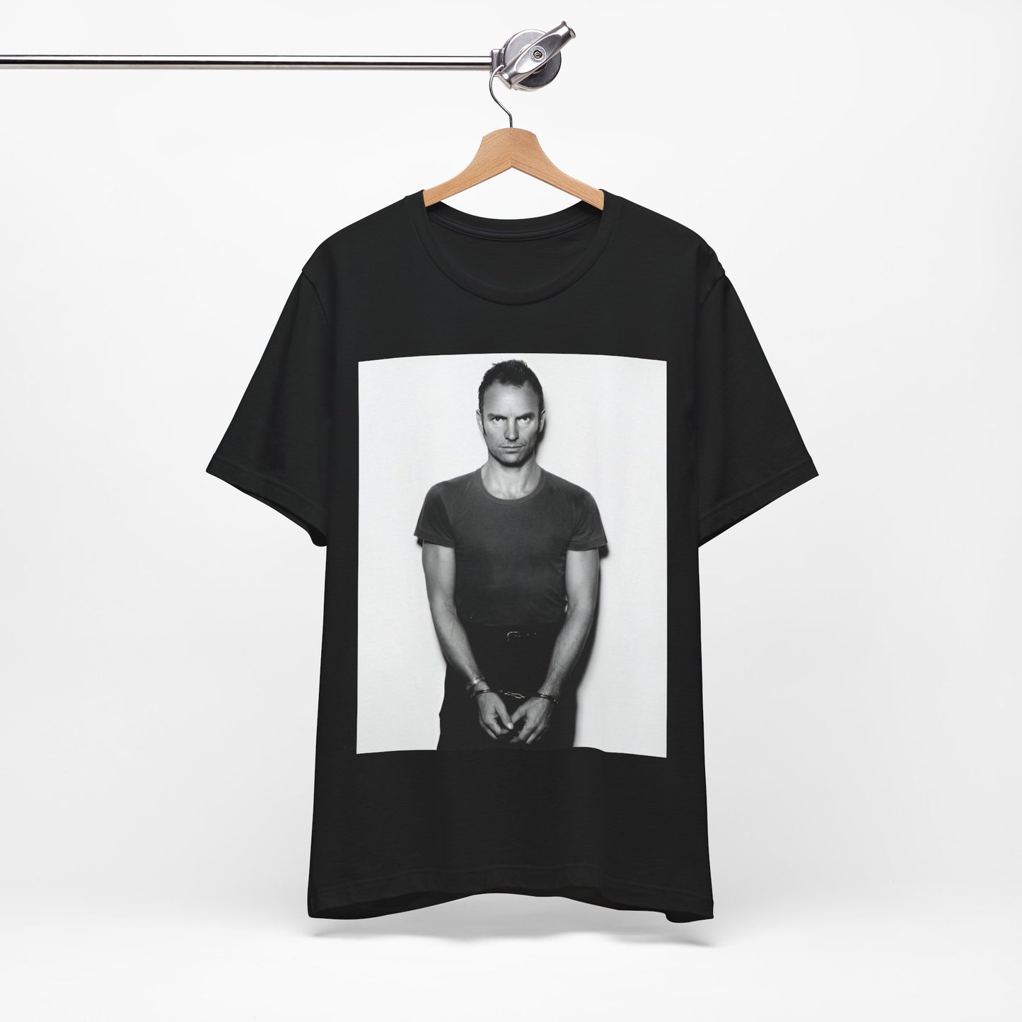 A black graphic t-shirt featuring a black and white portrait photo of Sting.