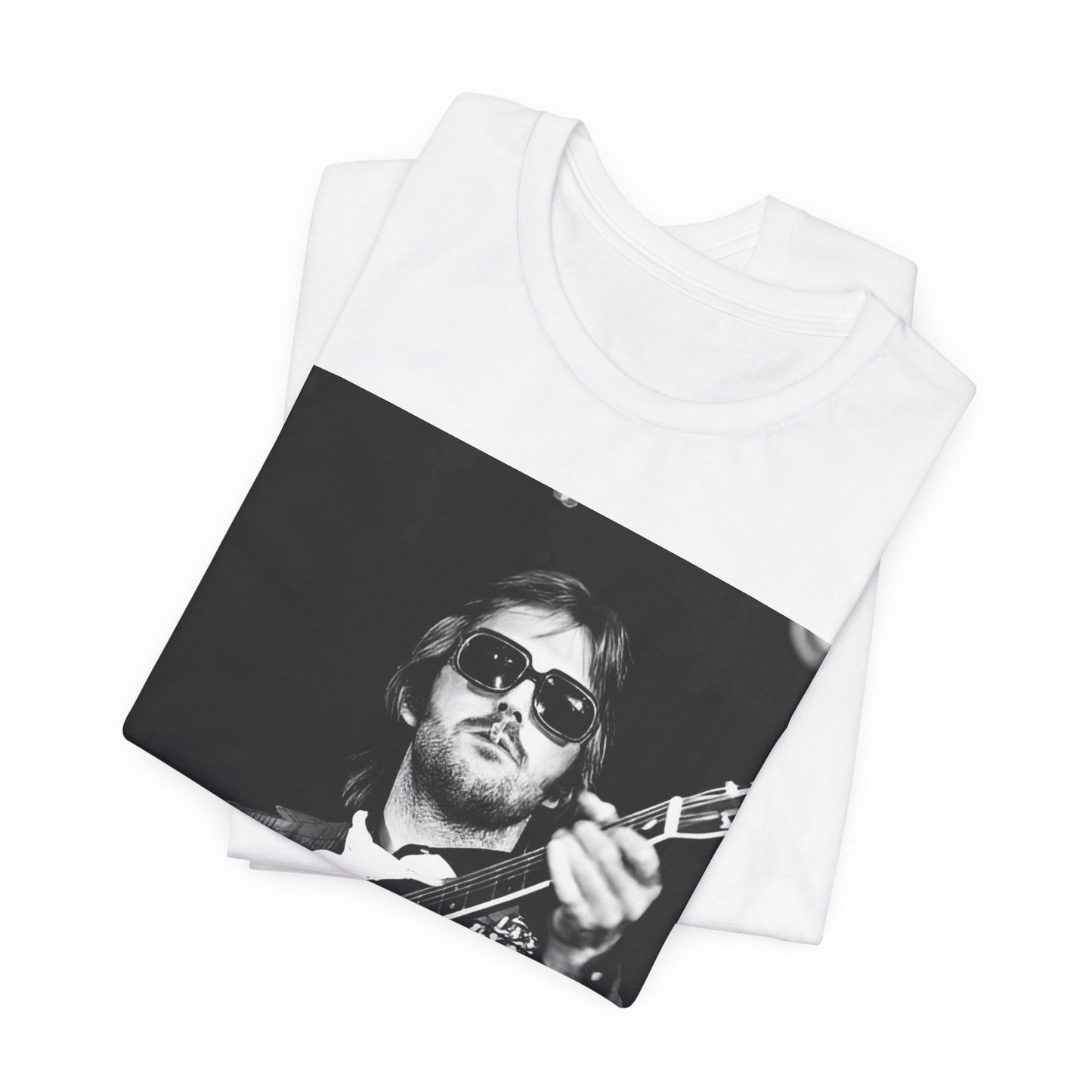 A black graphic t-shirt featuring a graphic of Eric Clapton with a chill blues rock vibe.
