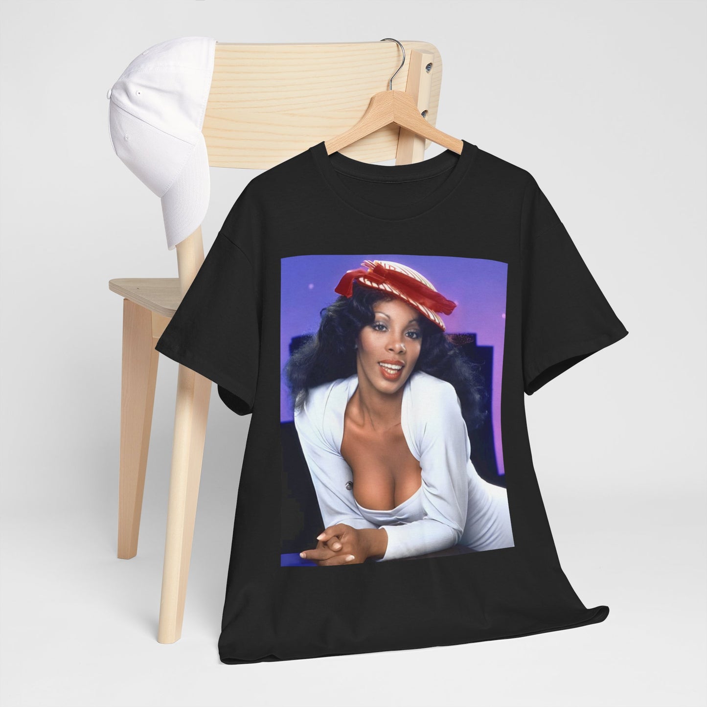 A black graphic t-shirt featuring a retro graphic related to Donna Summer's 'Bad Girls' album era.