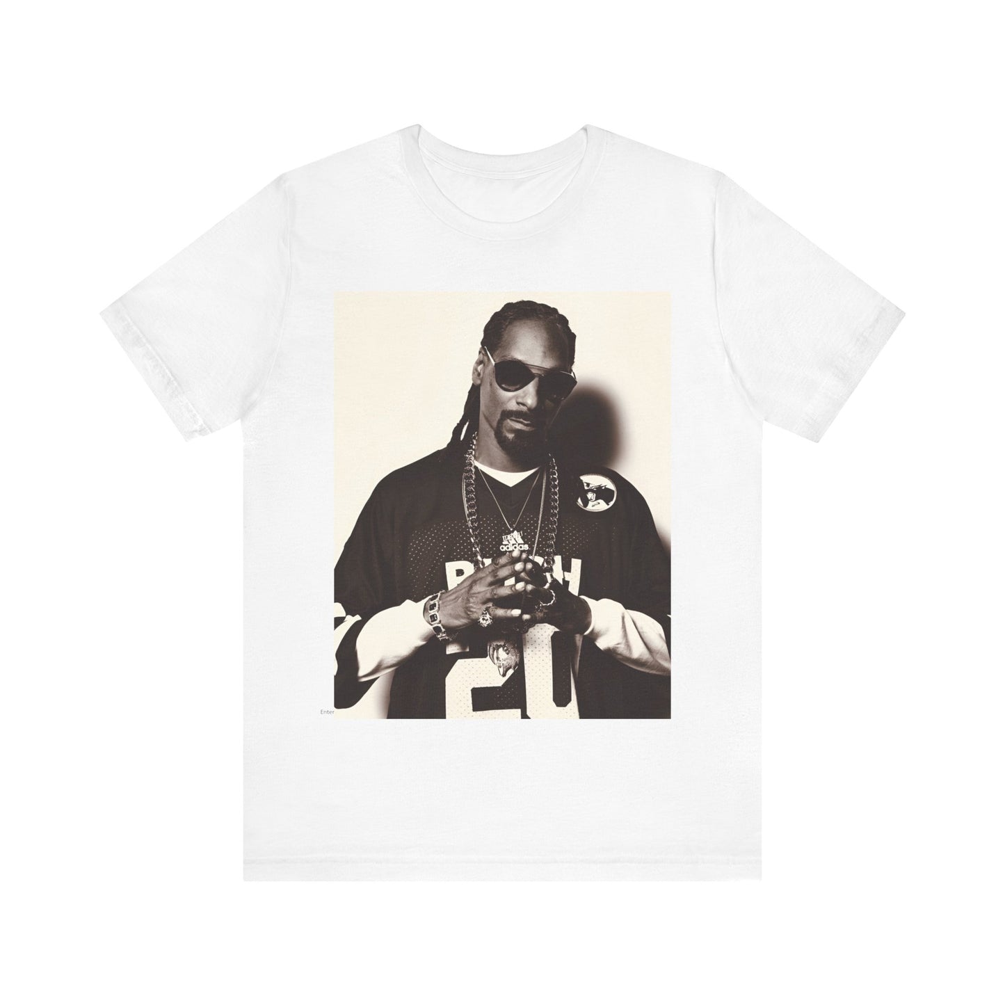 A black graphic t-shirt featuring a black and white, monochrome graphic or photo of Snoop Dogg in an OG style.