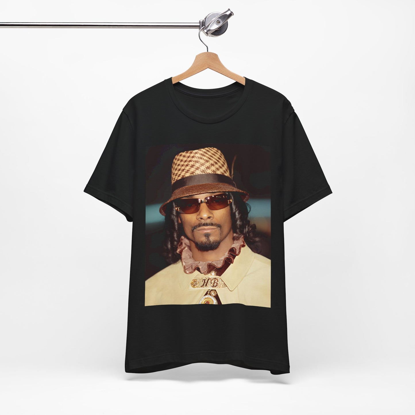 A black graphic t-shirt featuring a glamorous graphic of Snoop Dogg as a Doggfather icon.