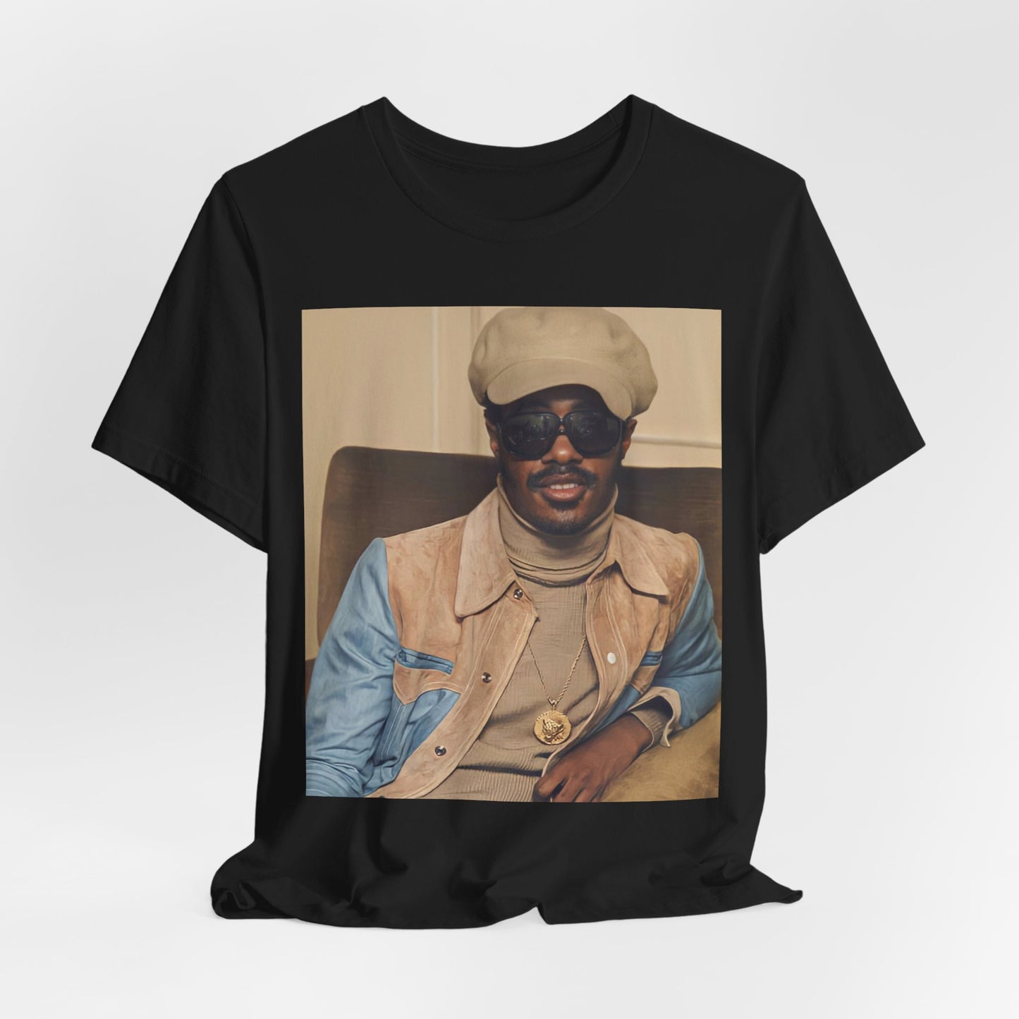 A black graphic t-shirt featuring a retro graphic related to Stevie Wonder's 'Songs in the Key of Life' album era.