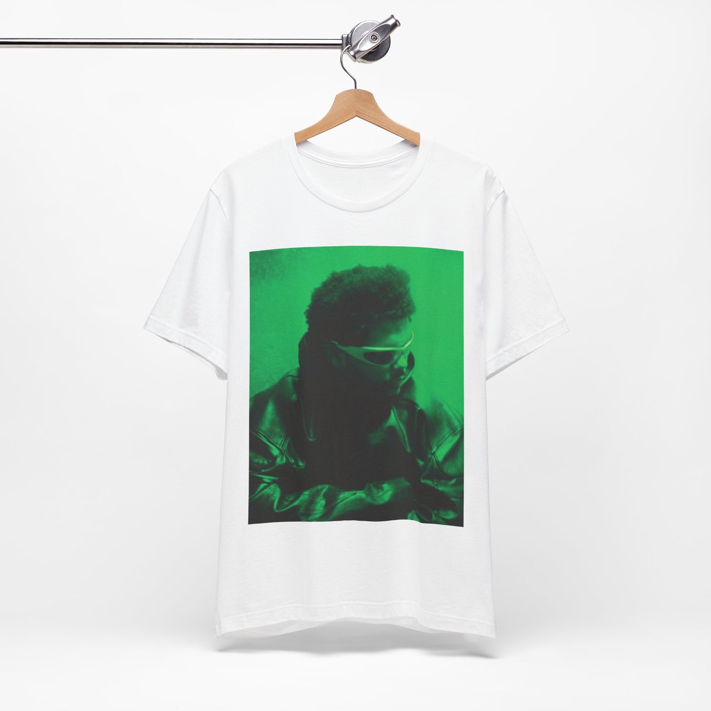 A black graphic t-shirt featuring a vintage graphic related to The Weeknd's 'Kiss Land' era.
