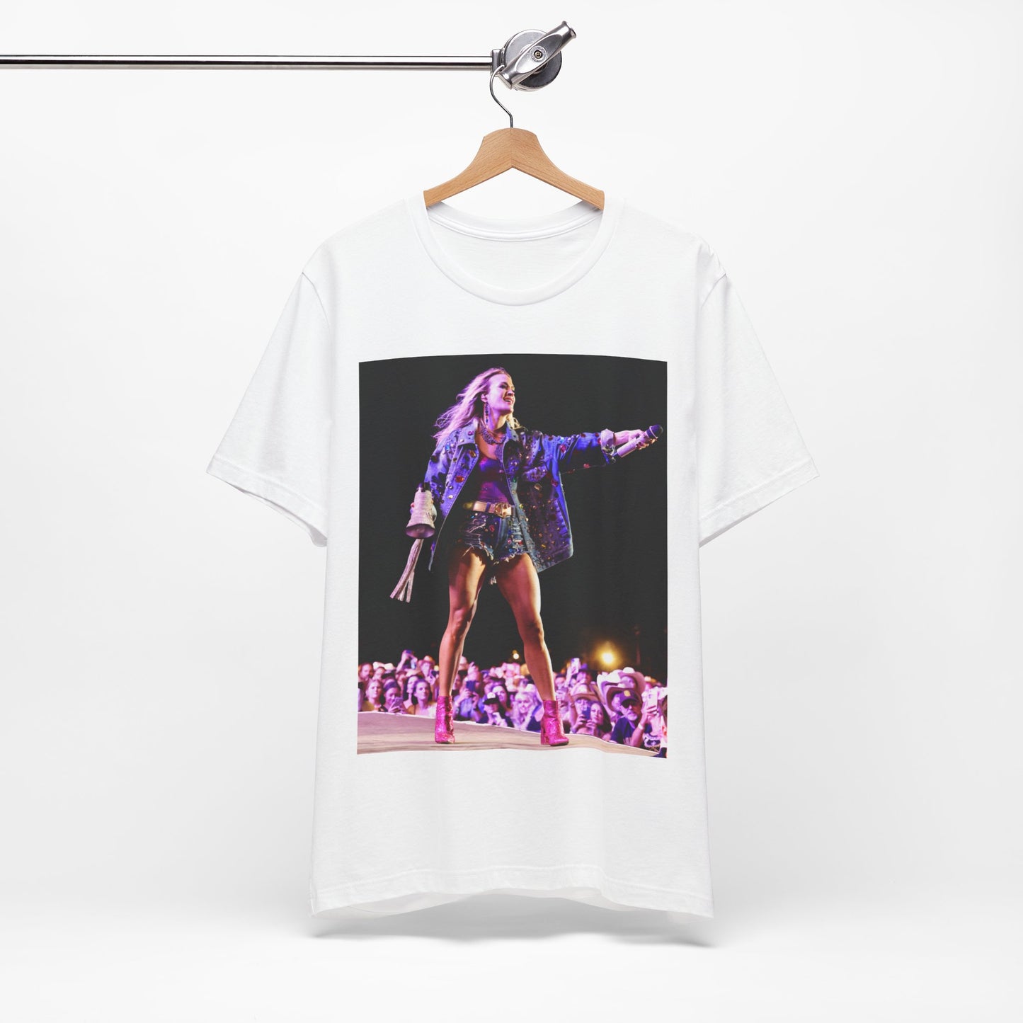 A black graphic t-shirt featuring a graphic of Carrie Underwood with Nashville-themed elements or skyline.