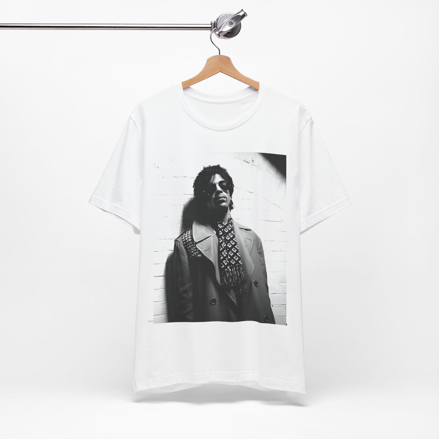 A black graphic t-shirt featuring Prince's iconic symbol, representing 'The Artist Formerly Known As'.
