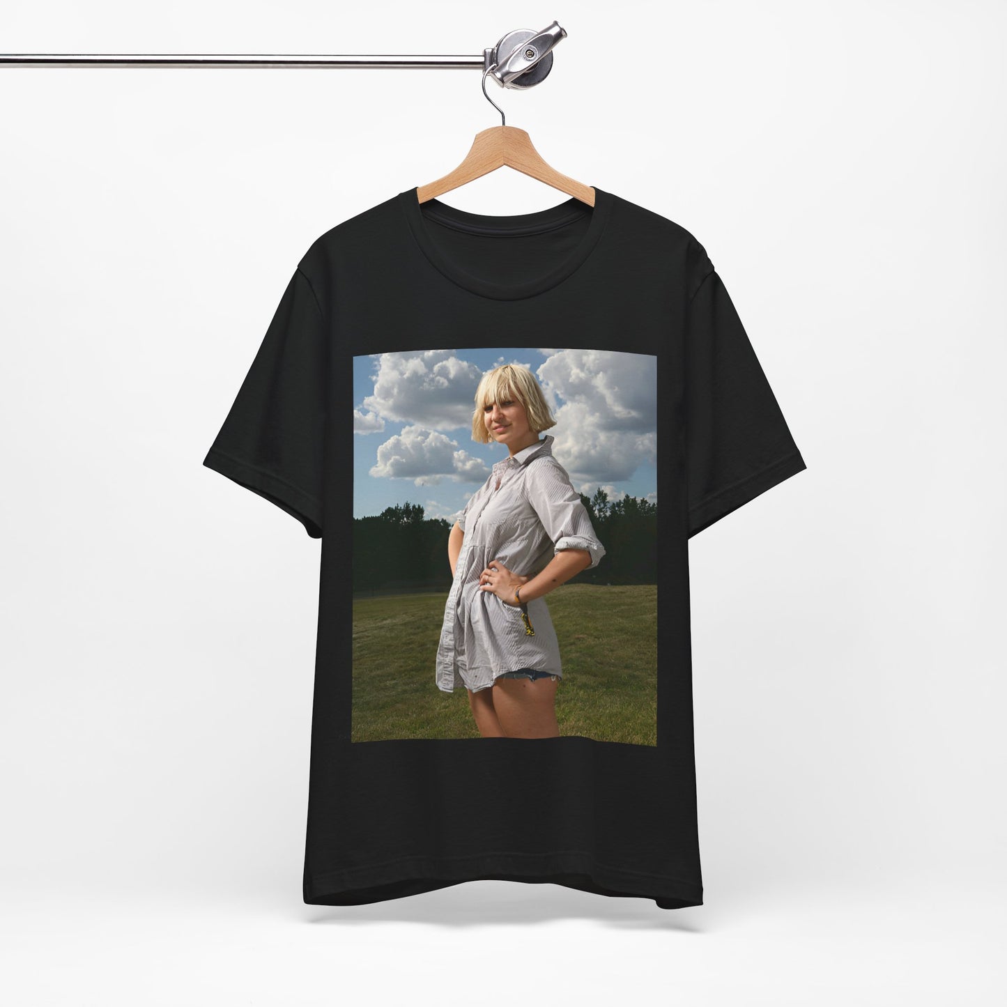 A black graphic t-shirt featuring a bold graphic of Sia as a pop superstar.