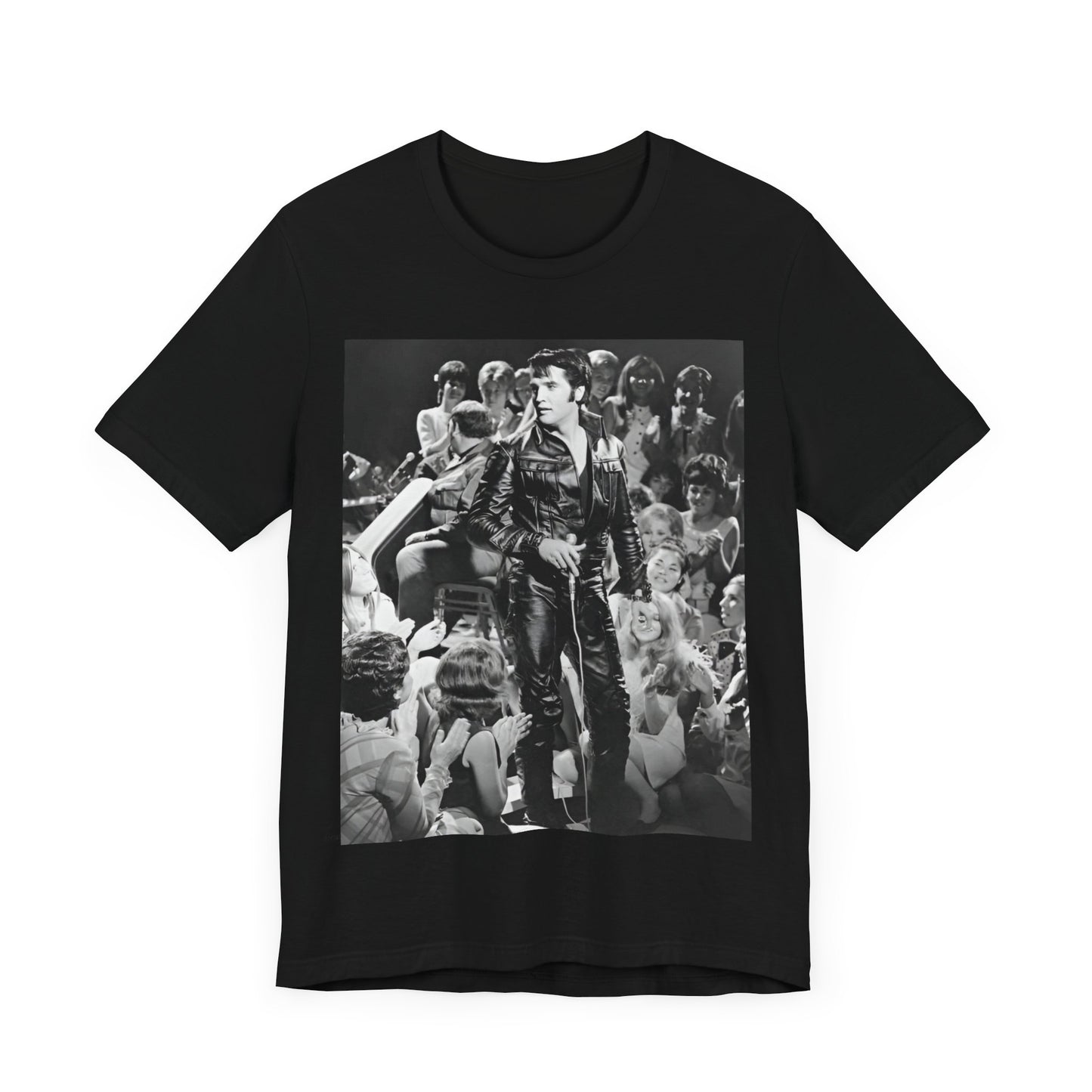 A black graphic t-shirt featuring a vintage black and white photo or graphic of Elvis Presley performing live on stage.