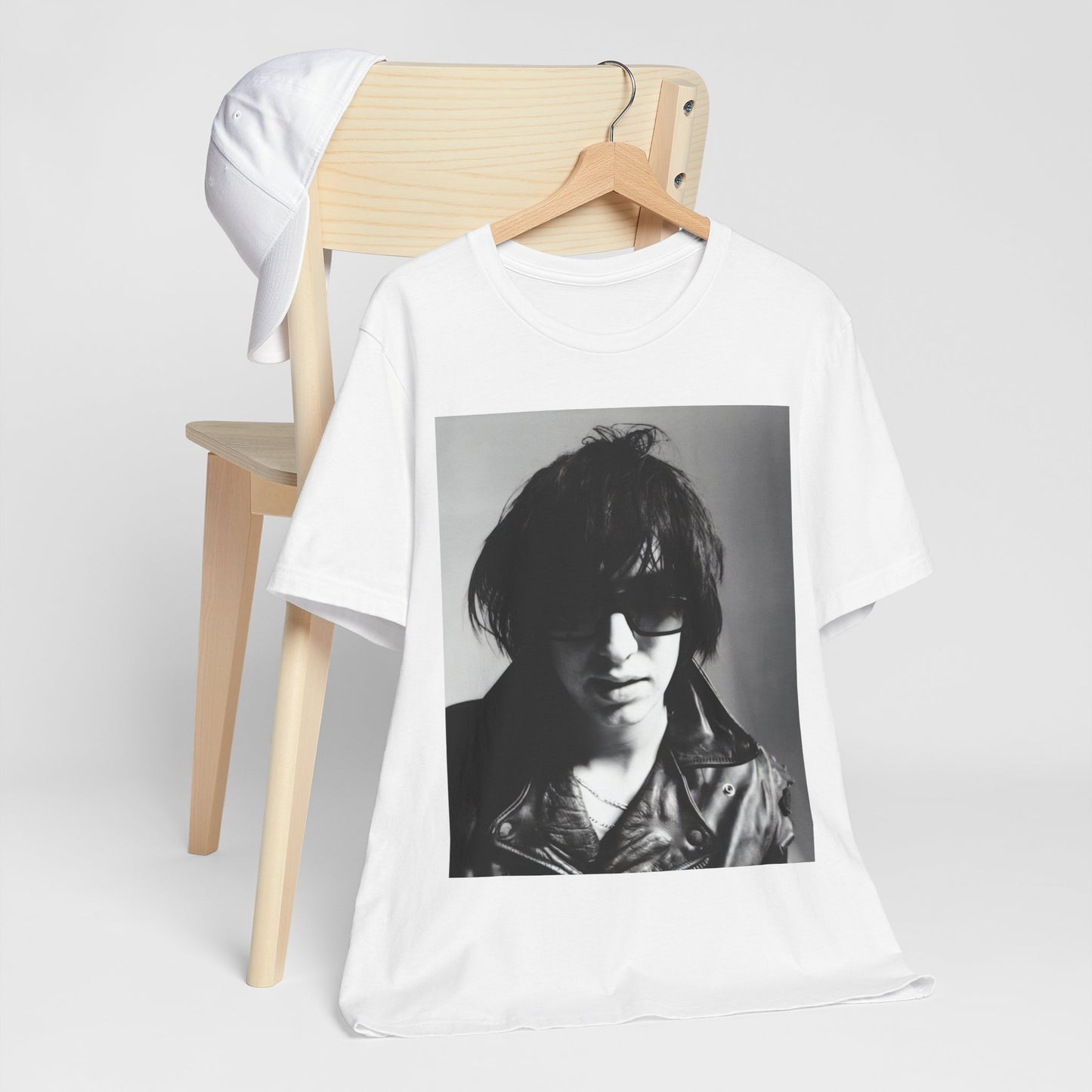 A black graphic t-shirt featuring a graphic related to The Strokes' 'Reptilia' song or era.