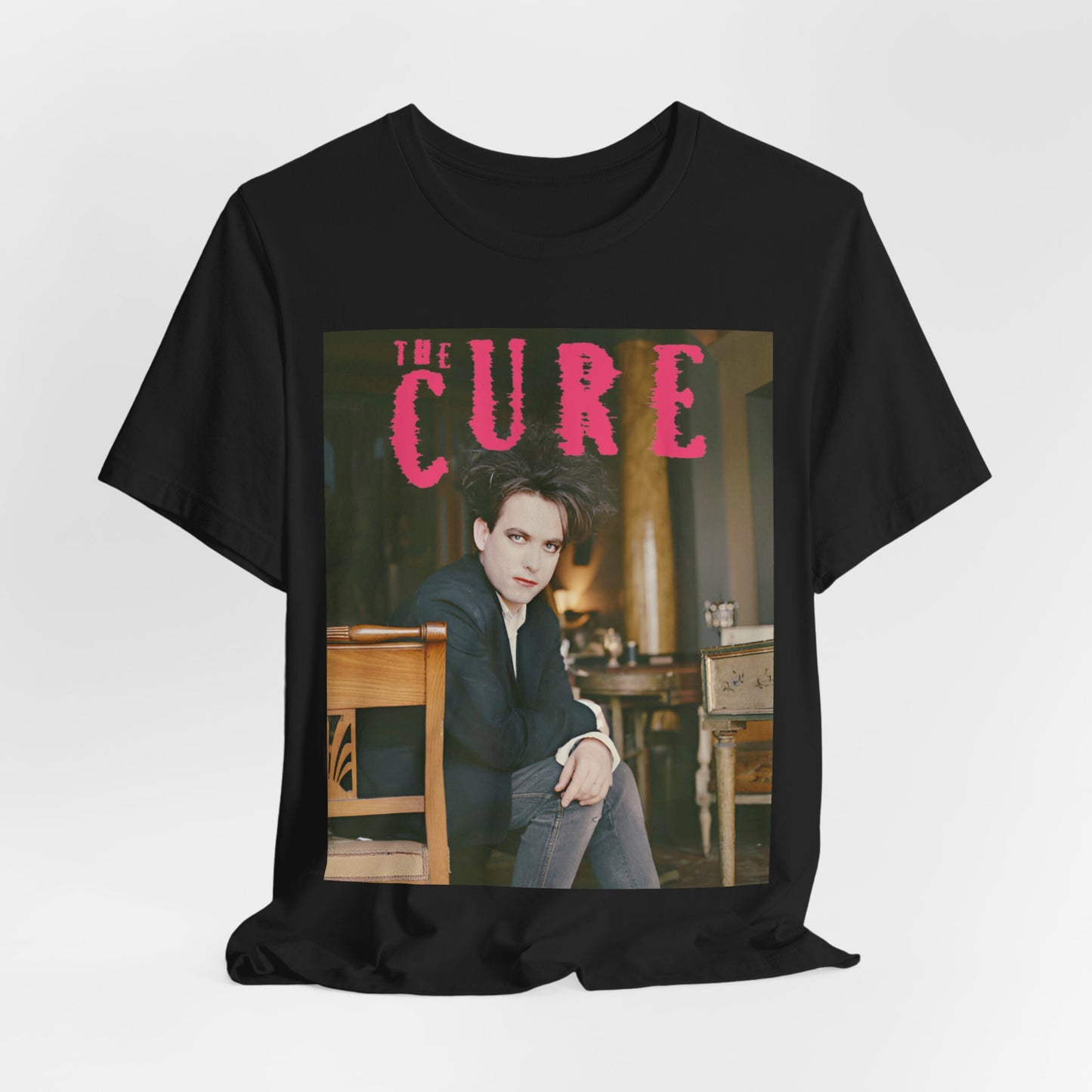 A black graphic t-shirt featuring a retro graphic related to The Cure's 'Disintegration' album era.