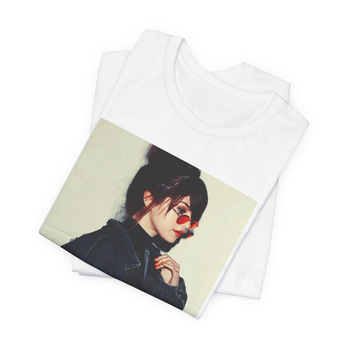 A black graphic t-shirt featuring a bold graphic of Selena Gomez as a pop superstar.