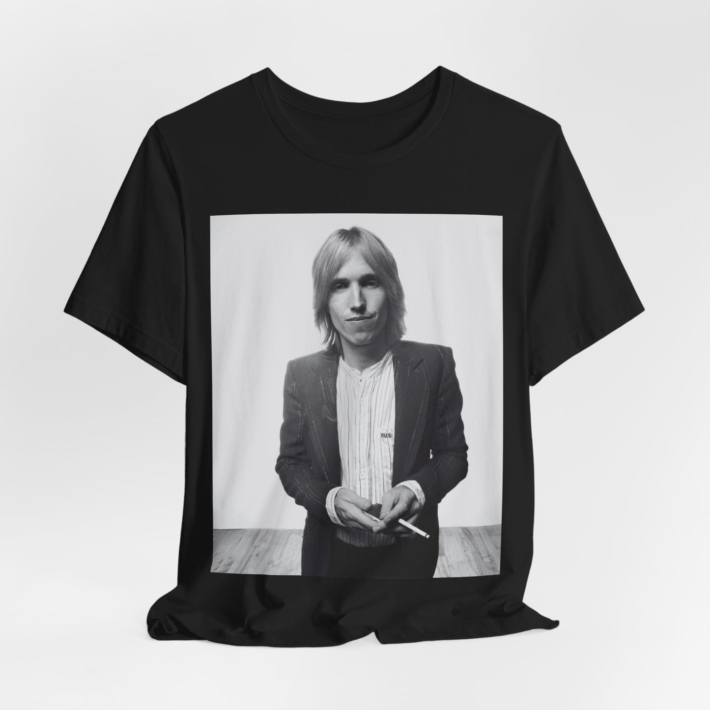 A black graphic t-shirt featuring a graphic of Tom Petty with rock legend vibes.