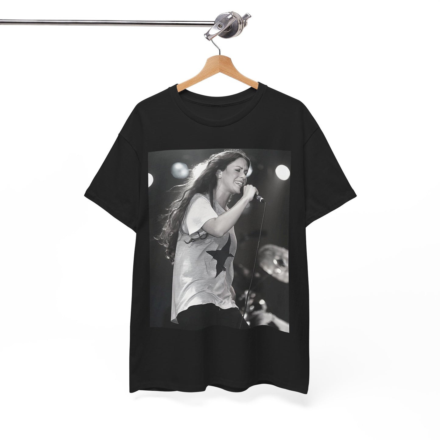 A black graphic t-shirt featuring a photo of Alanis Morissette performing live on stage in the 1990s, with a dynamic expression.