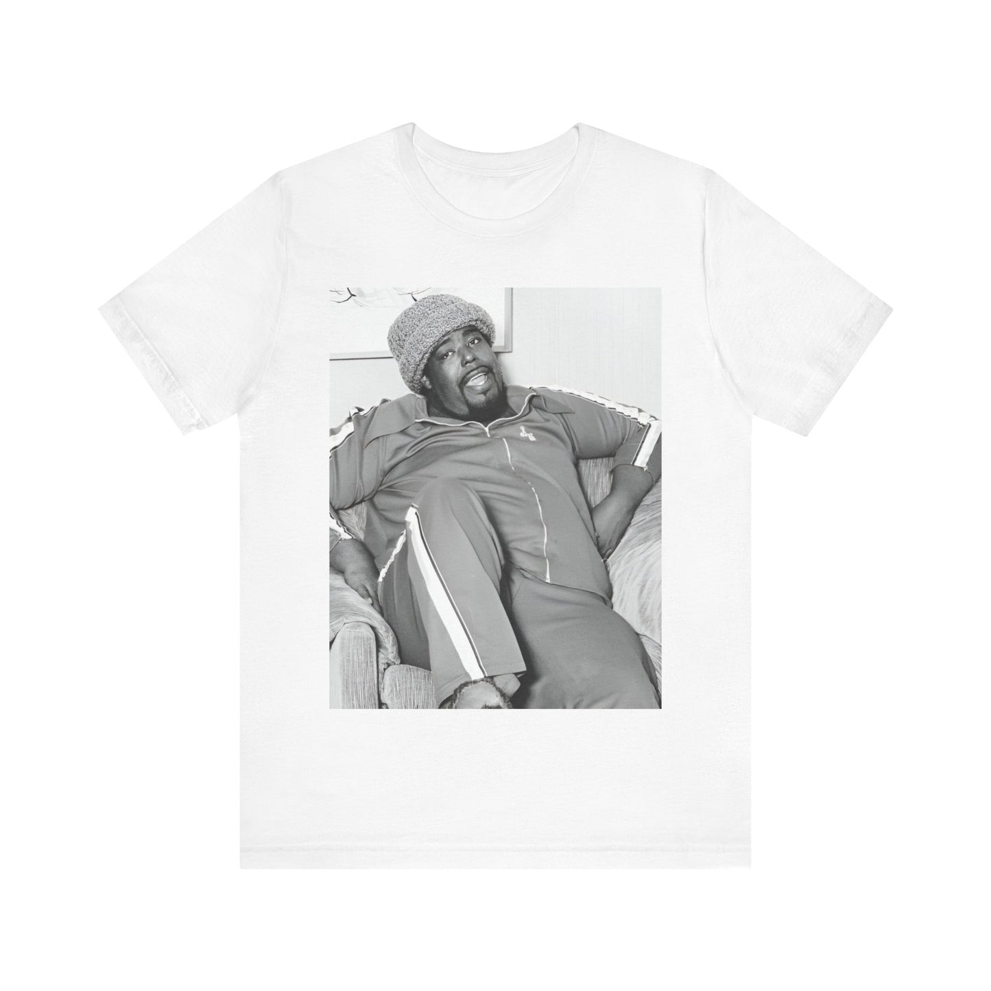 A black graphic t-shirt featuring a 70s-style portrait photo of Barry White in a lounge setting.