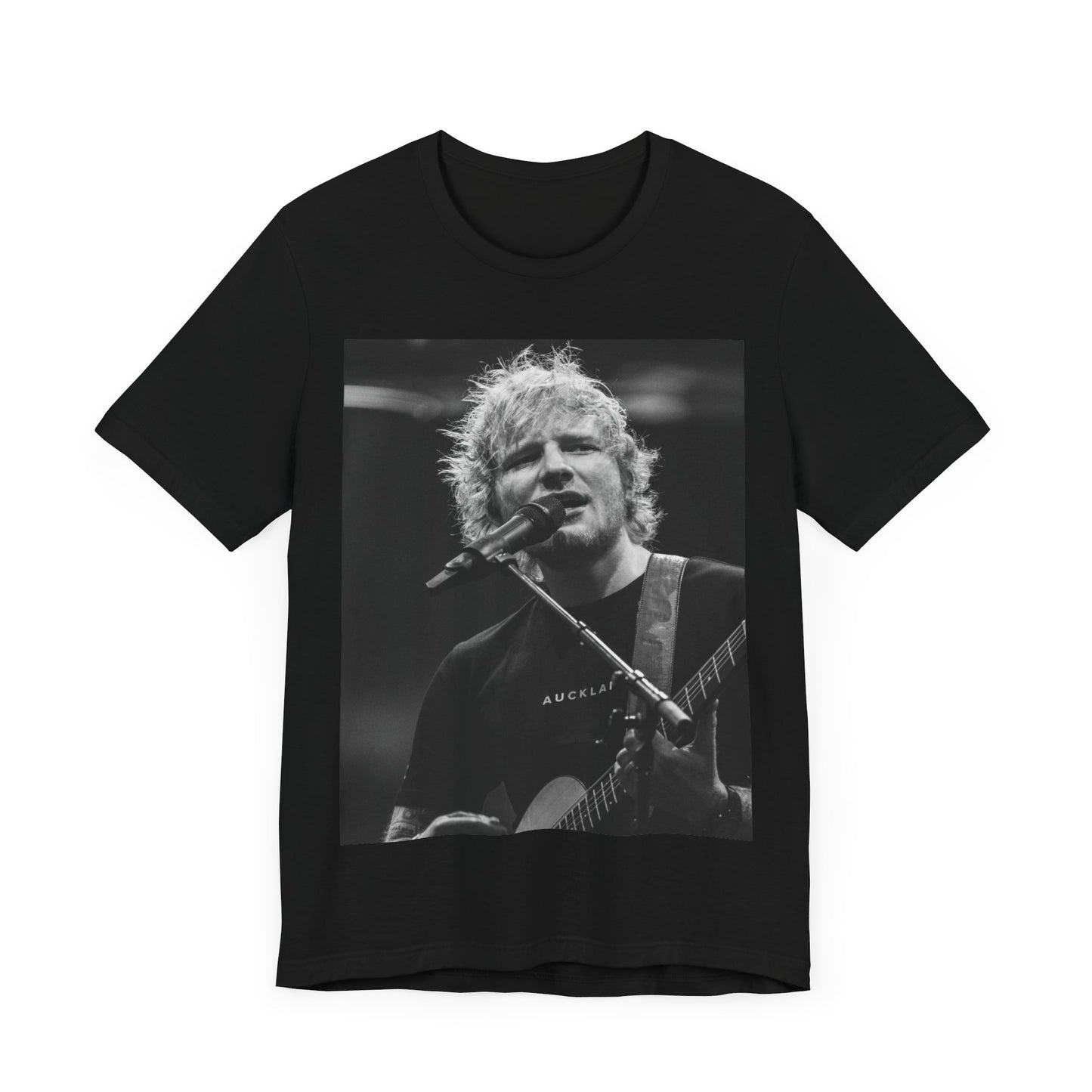 A black graphic t-shirt featuring a black and white photo of Ed Sheeran performing live.