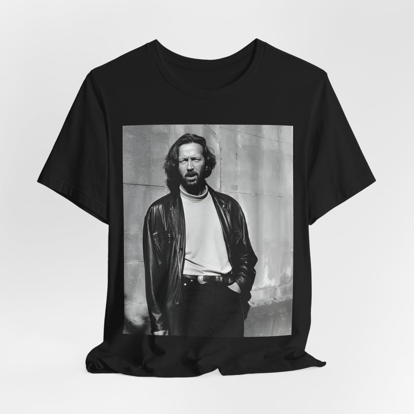 A black graphic t-shirt featuring a retro graphic related to Eric Clapton's 'Cocaine' song or era.