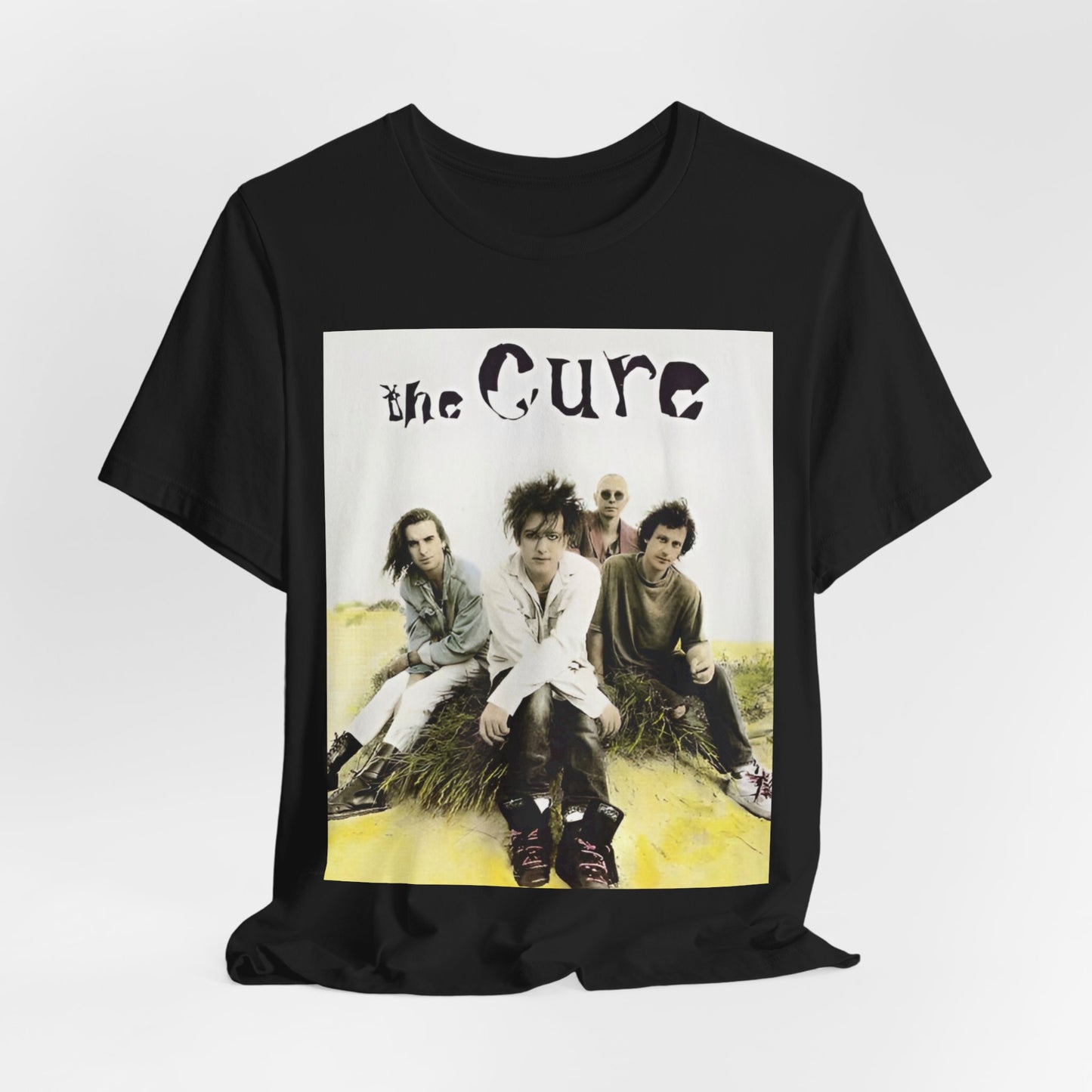 A black graphic t-shirt featuring a graphic of The Cure as post-punk pioneers.