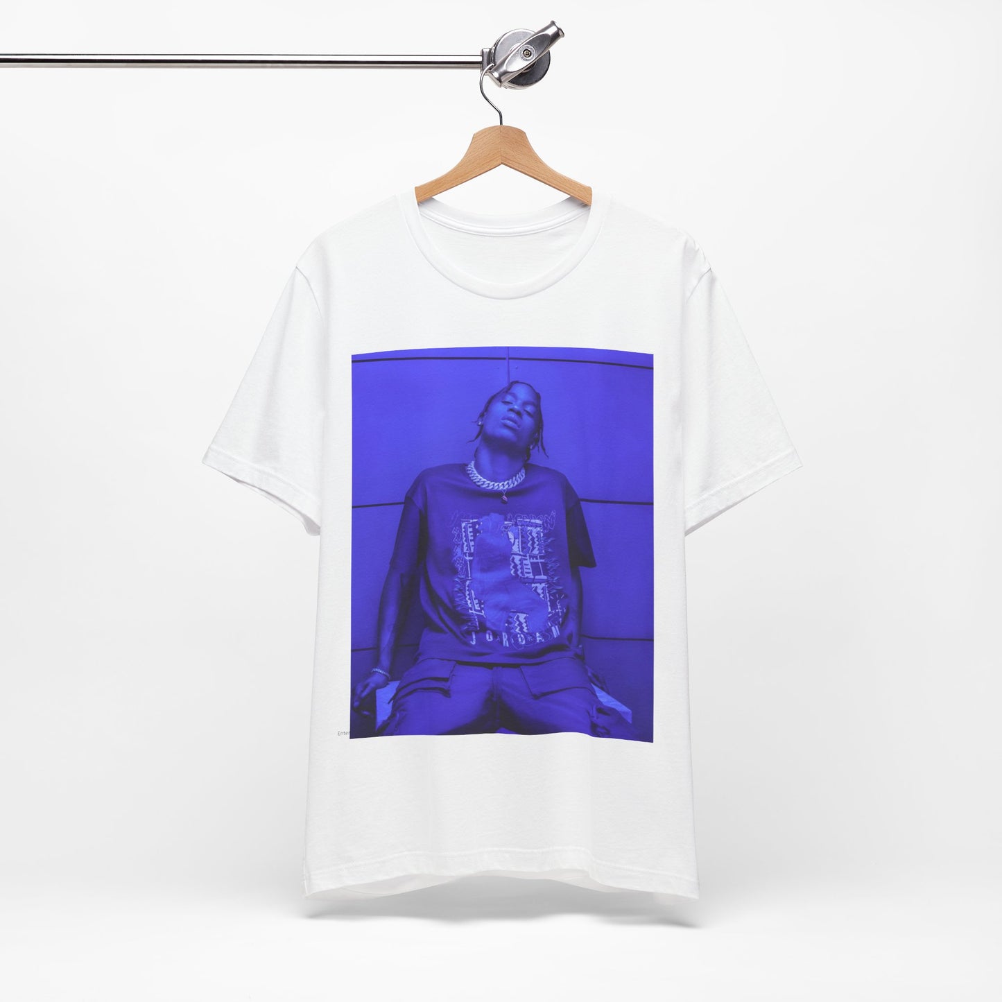 A black graphic t-shirt featuring a timeless trap star graphic of Travis Scott.