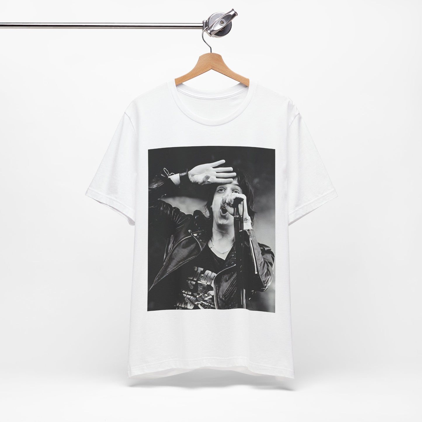 A black graphic t-shirt featuring a black and white portrait photo of The Strokes band.