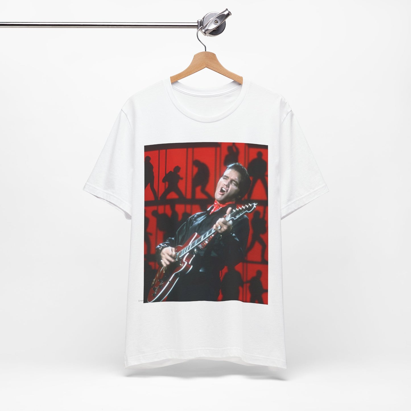 A black graphic t-shirt featuring a vintage photo of Elvis Presley from his Las Vegas residency.
