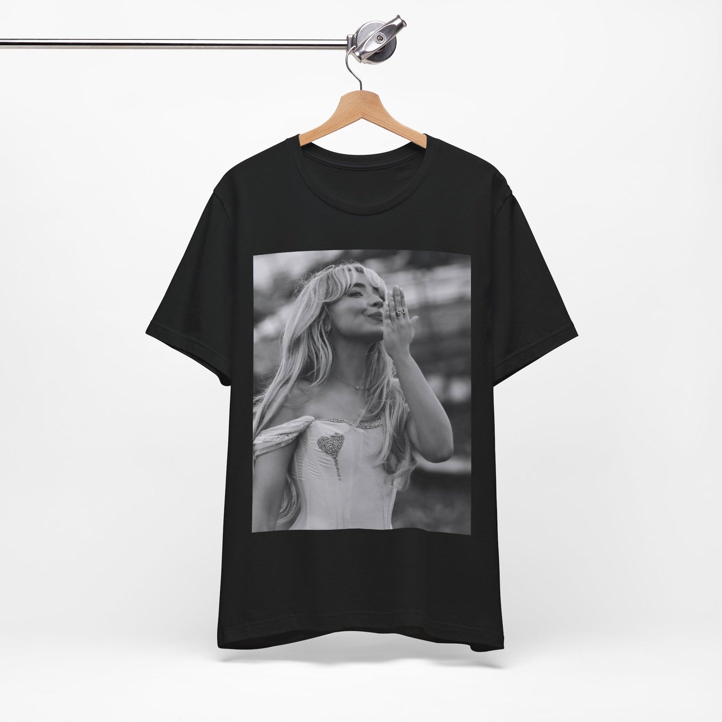 A black graphic t-shirt featuring a graphic or photo of Sabrina Carpenter kissing on stage during a performance.