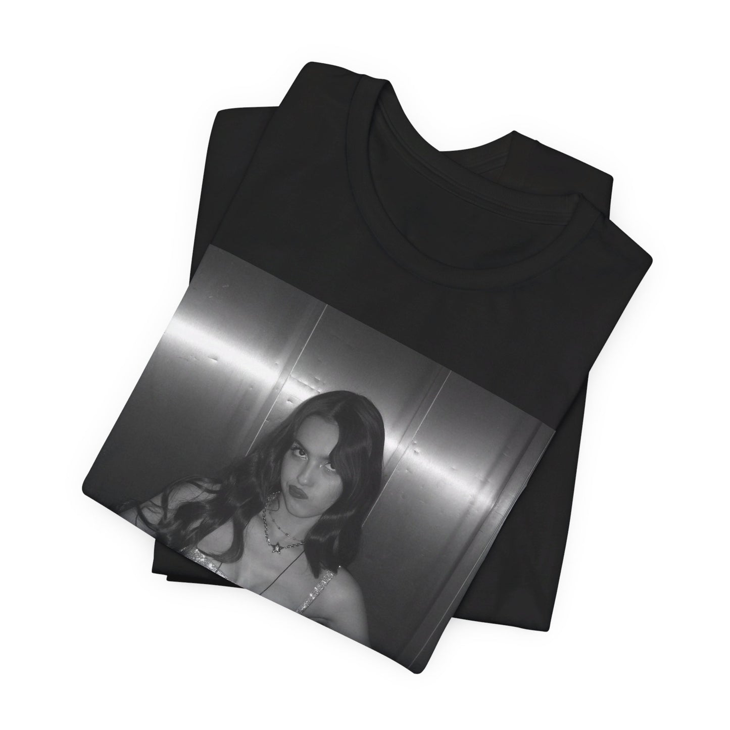 A black graphic t-shirt featuring a black and white portrait photo of Olivia Rodrigo.