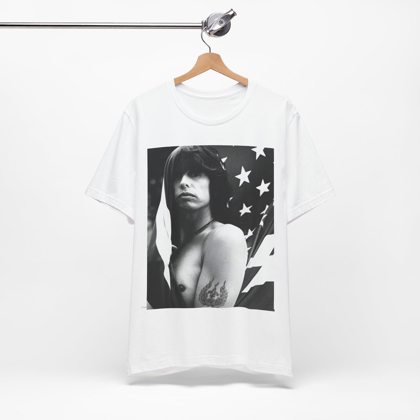 A black graphic t-shirt featuring a retro 70s-style illustration or photo of Aerosmith, integrated with elements of the American flag.