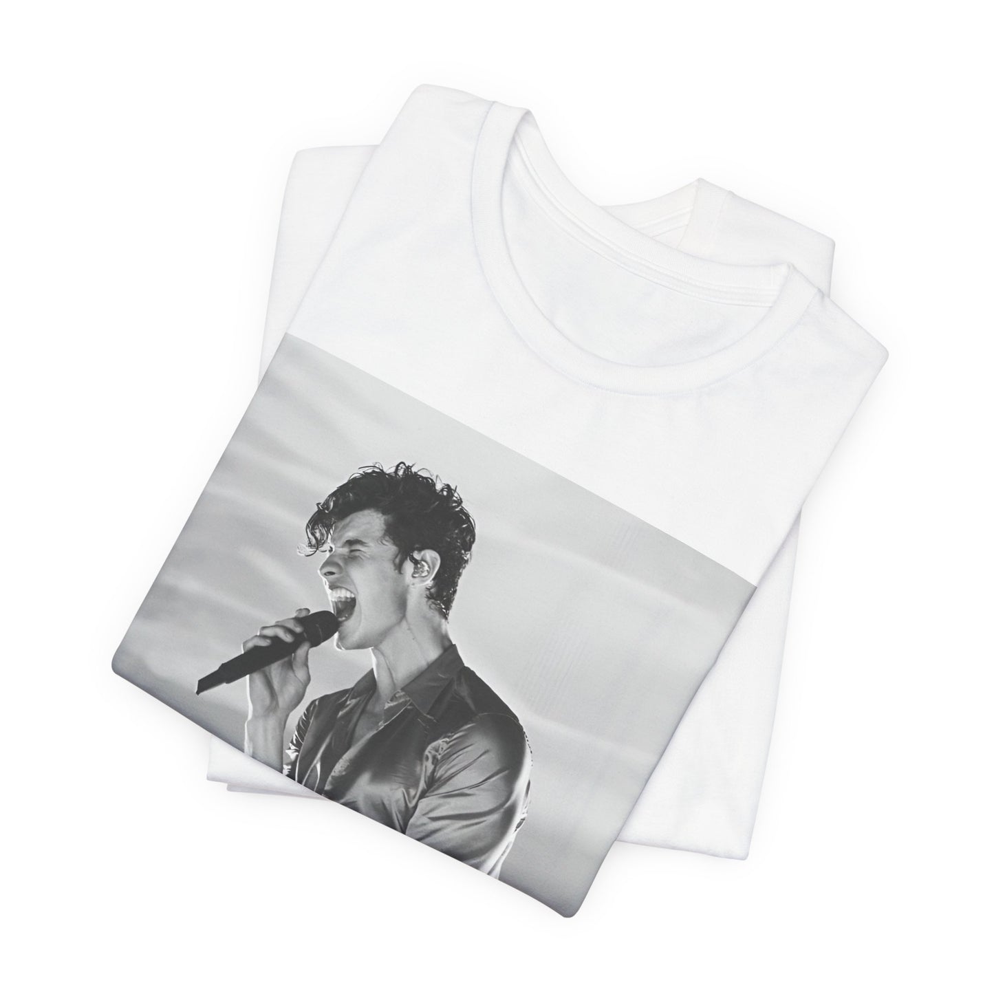A black graphic t-shirt featuring a black and white graphic or photo of Shawn Mendes as a dreamy pop star.