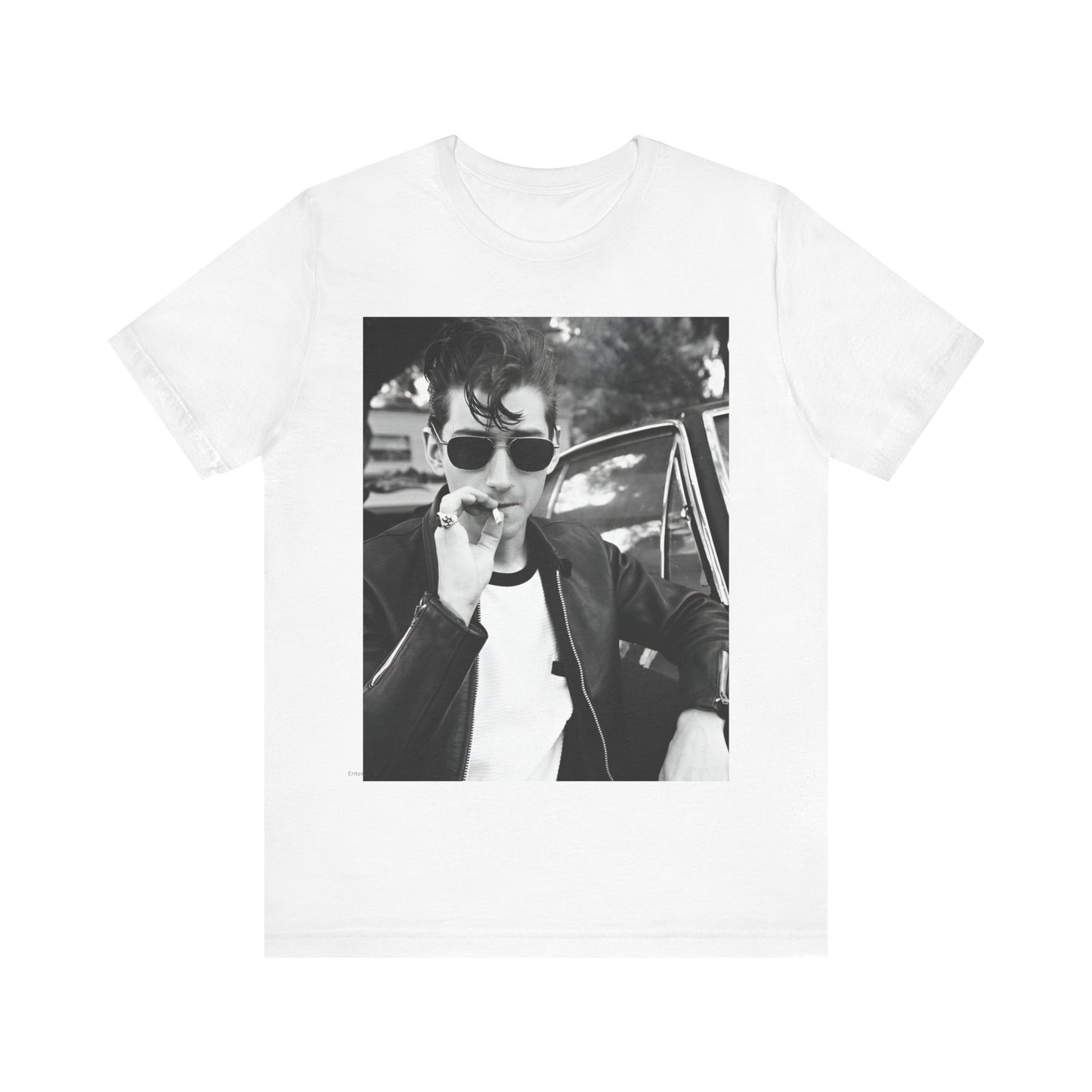 A black graphic t-shirt featuring a classic rock-style graphic of the Arctic Monkeys, possibly with band members in a stylized design.