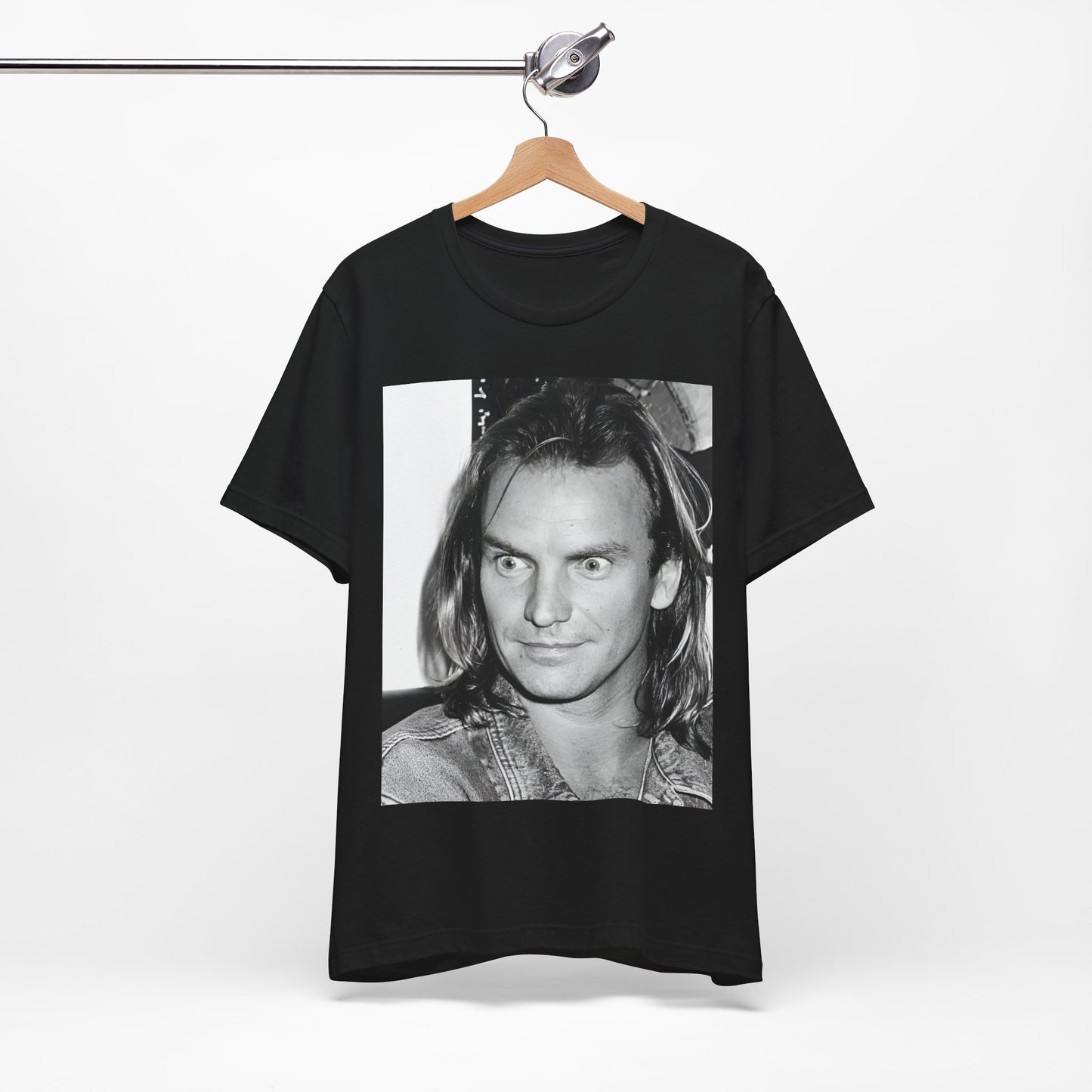A black graphic t-shirt featuring a retro graphic related to Sting's 'Synchronicity' album era.