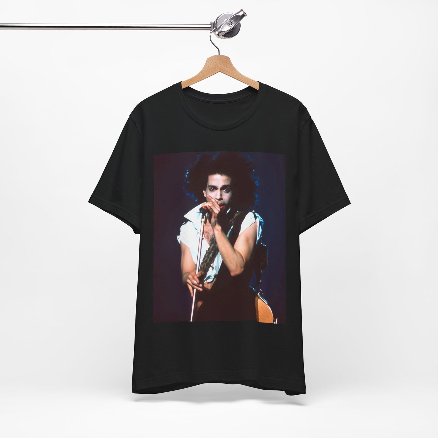 A black graphic t-shirt featuring a 90s live performance graphic of Prince.