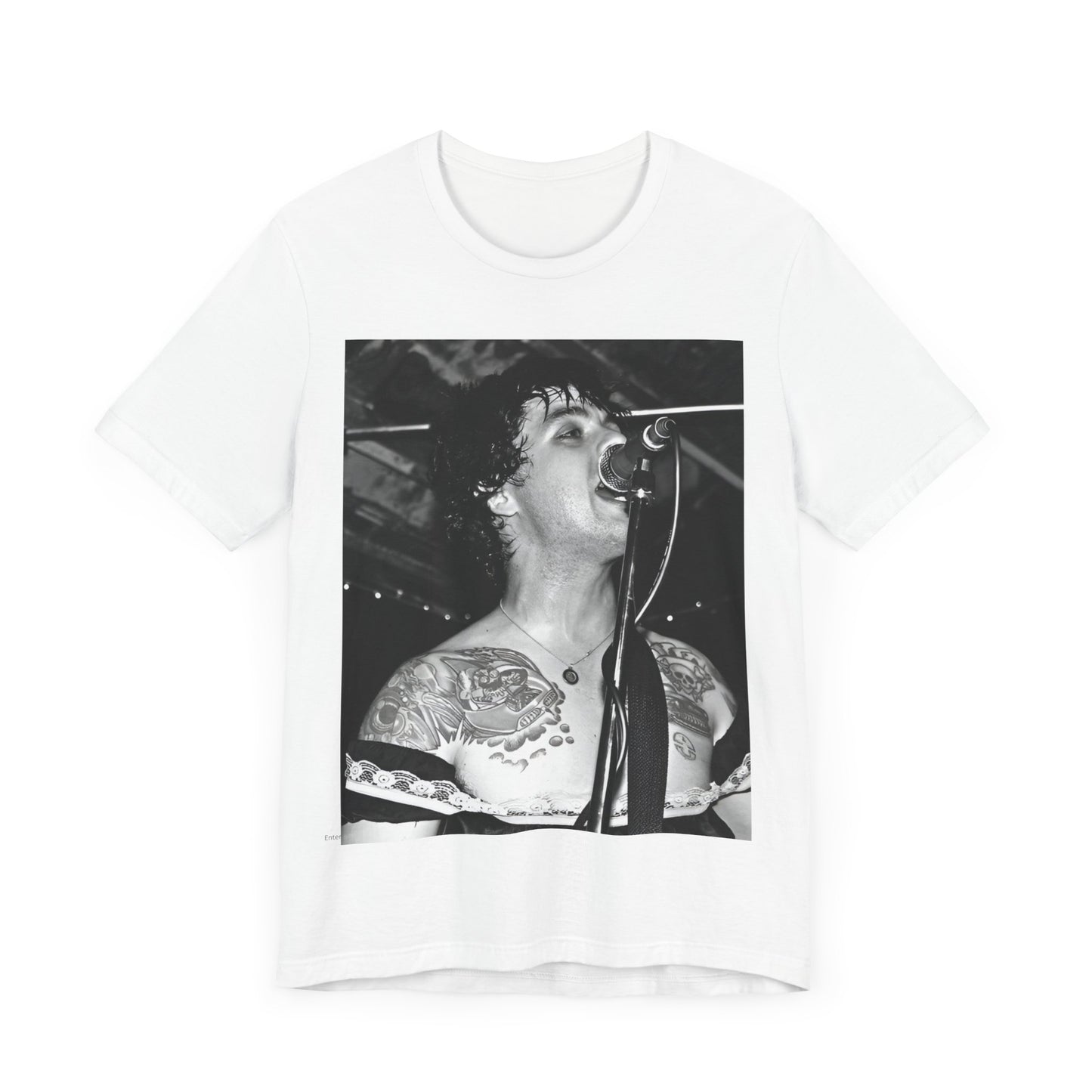 A black graphic t-shirt featuring a black and white graphic or photo of Green Day performing live on stage.